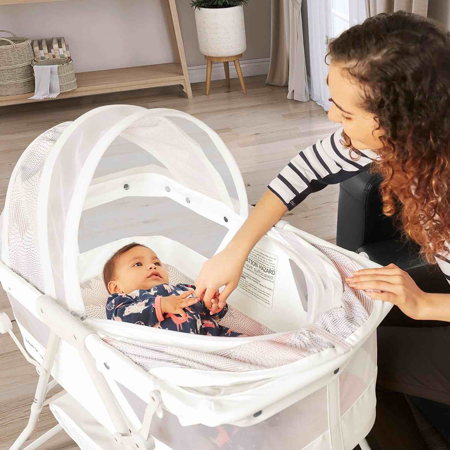 Karley Bassinet in Dove White, Lightweight Portable Baby Bassinet, Quick Fold and Easy to Carry, Adjustable Double Canopy, Indoor and Outdoor Bassinet with Large Storage Basket.