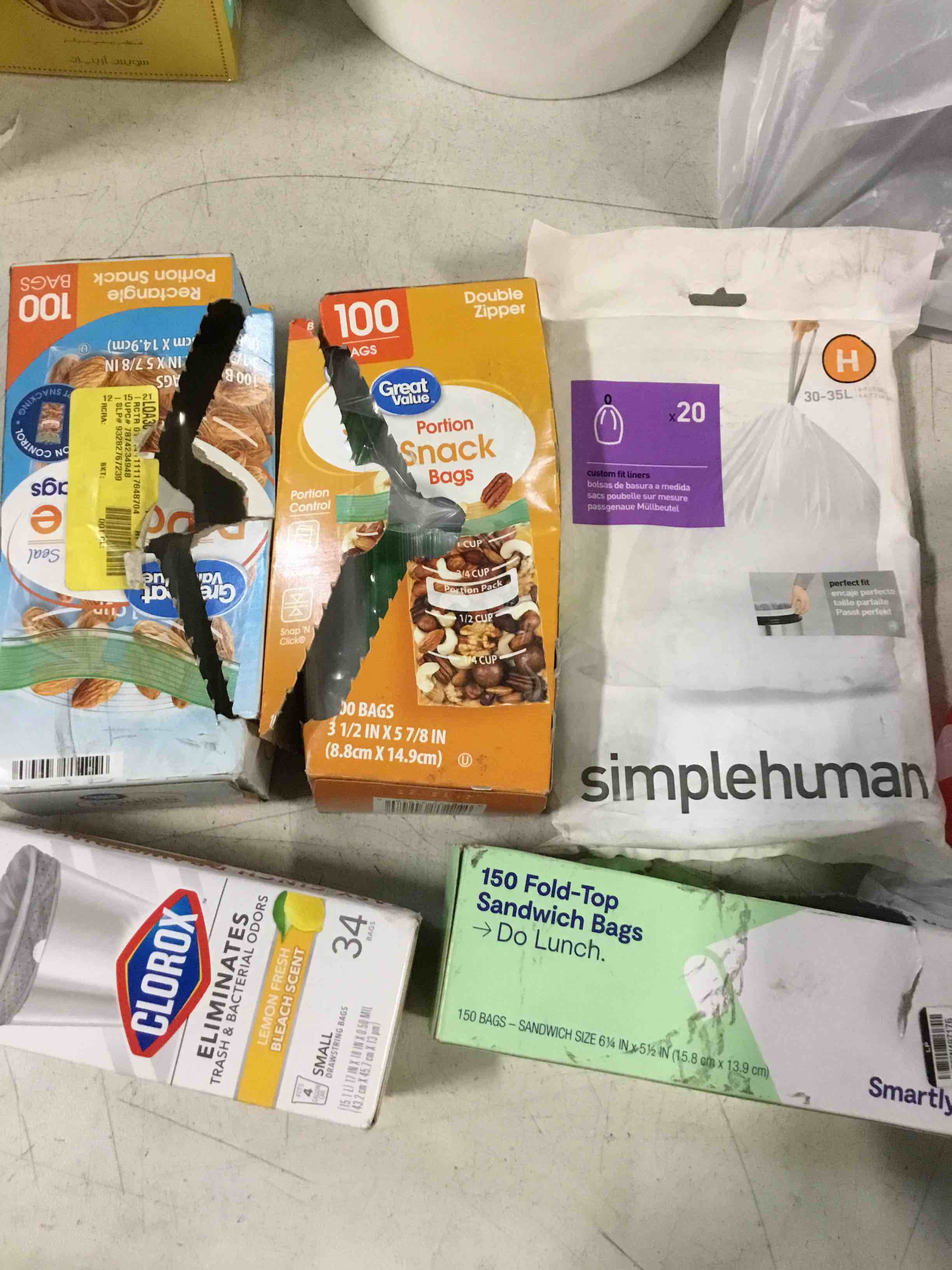 Assortment of kitchen bags of different sizes and brands