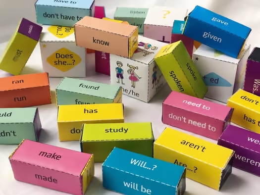 cubes with pronouns in a English