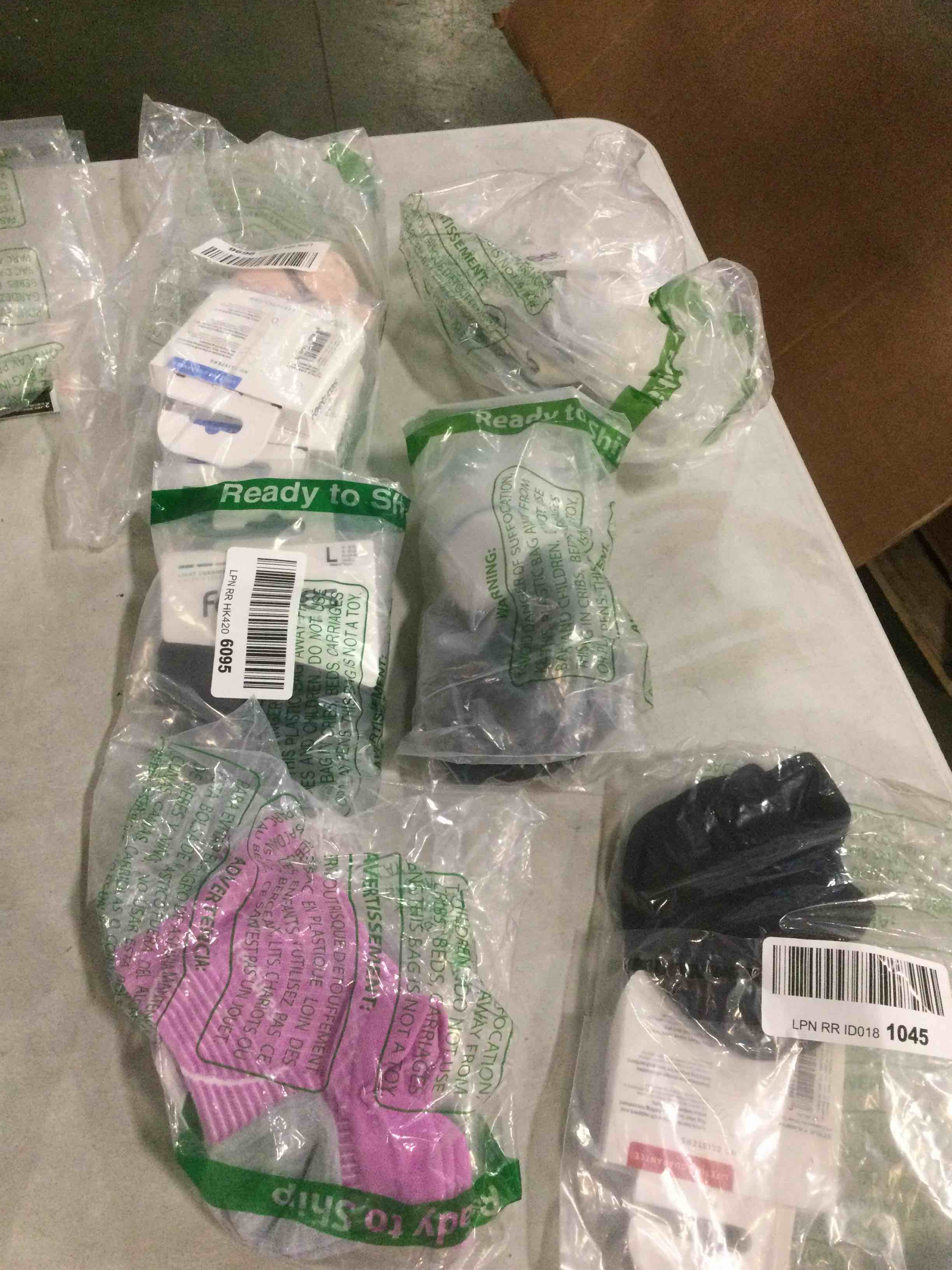 assorted socks and insoles varying in sizes and styles