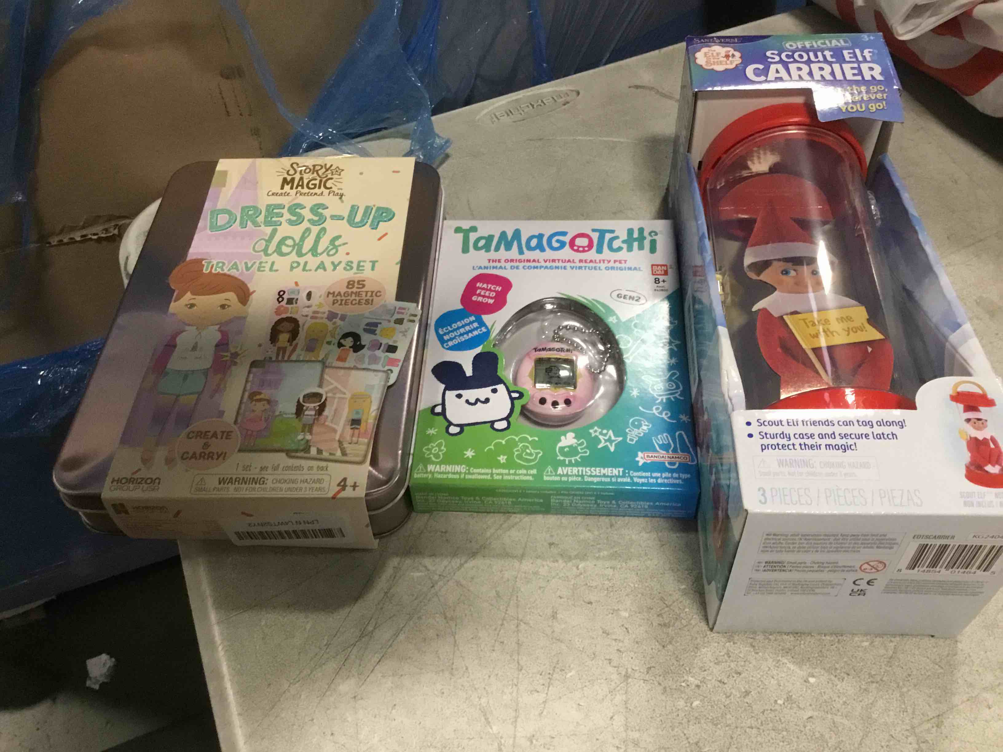 assortment of toys for kids boys and girls of different ages that including,Story magic Dress -Up dolls Travel Playset, Tamagotchi And the Elf on the Shelf