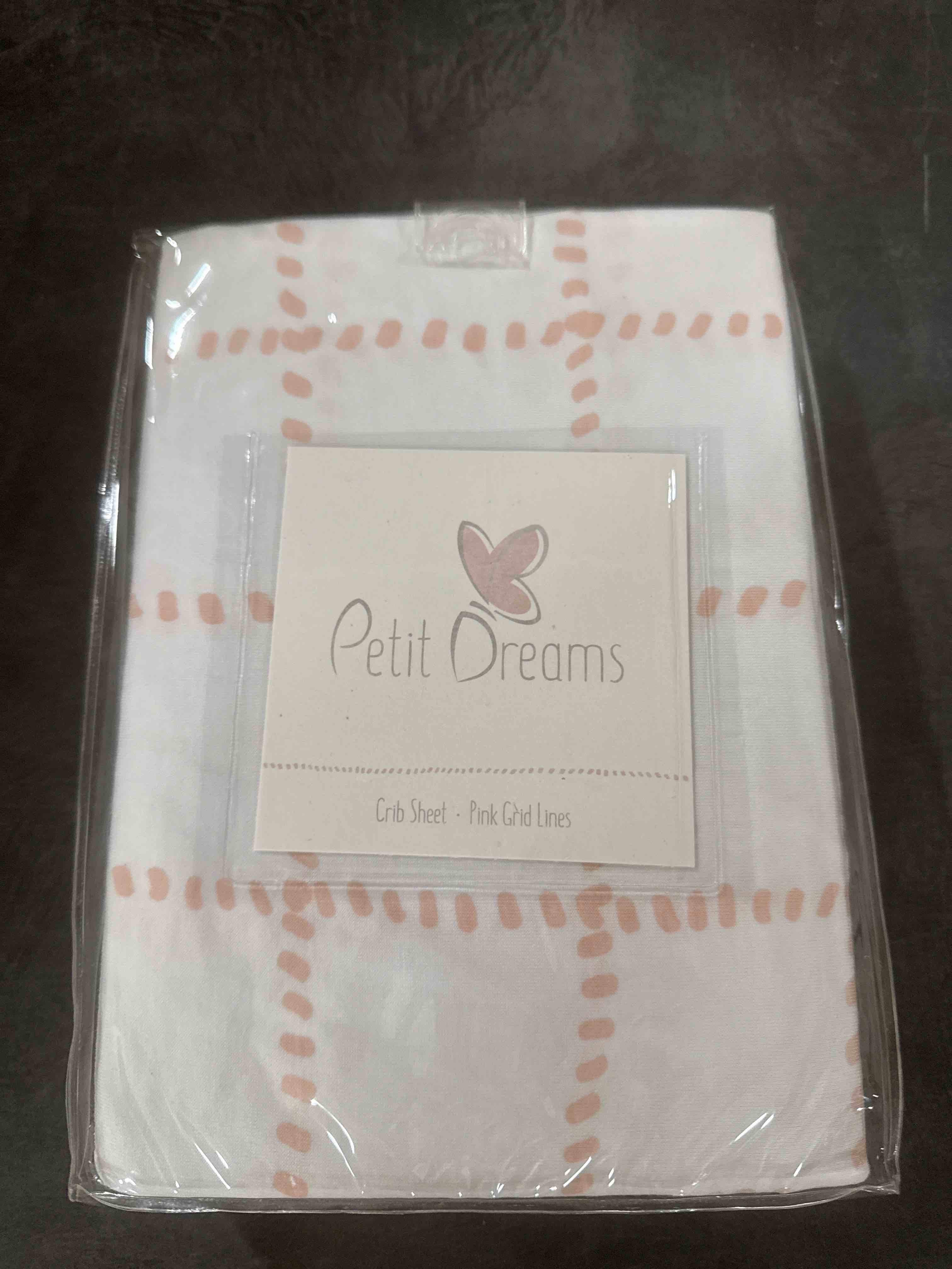 Petit dreams crib sheet pink grid lines 