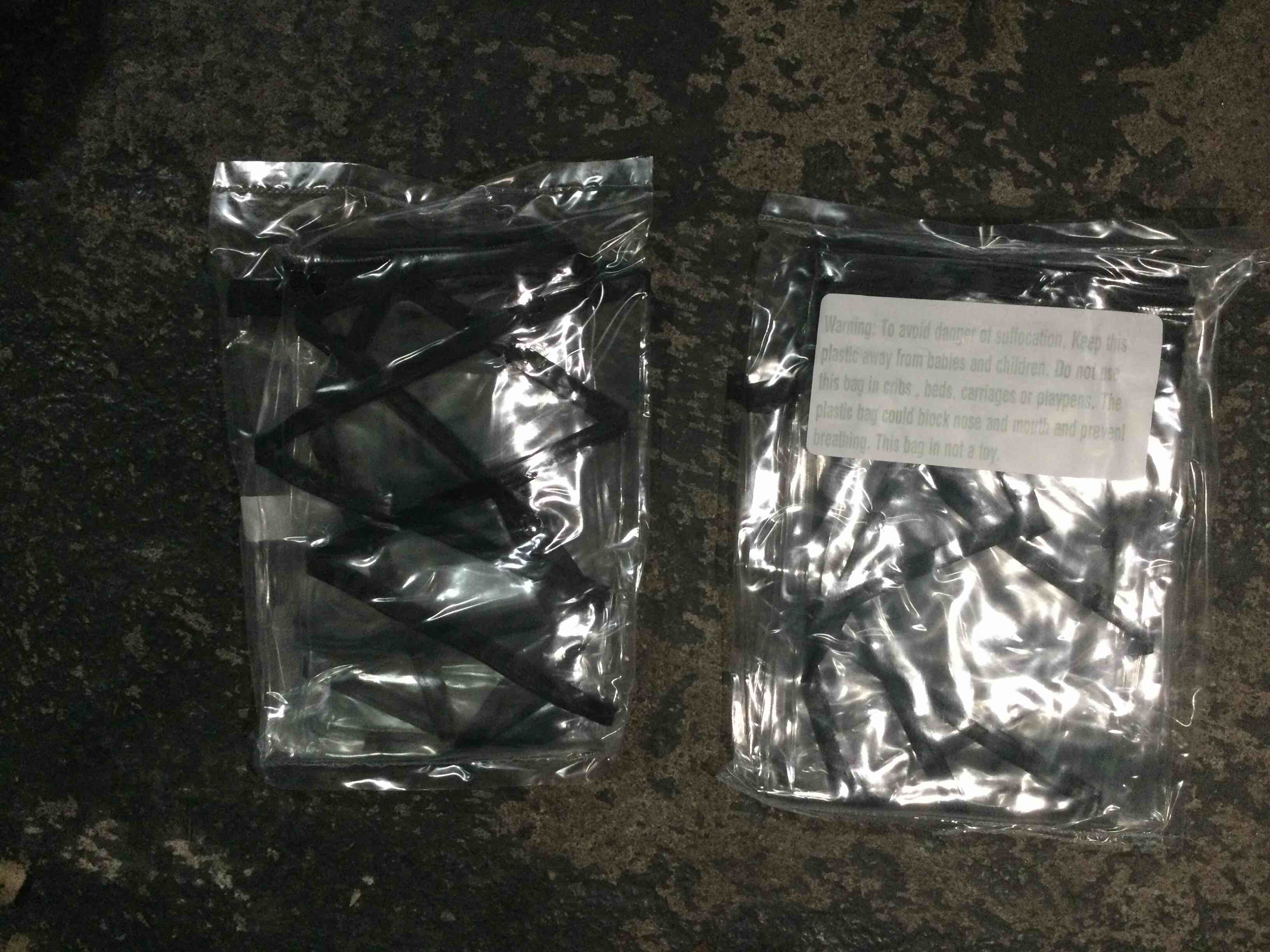 small black and clear garment bag 