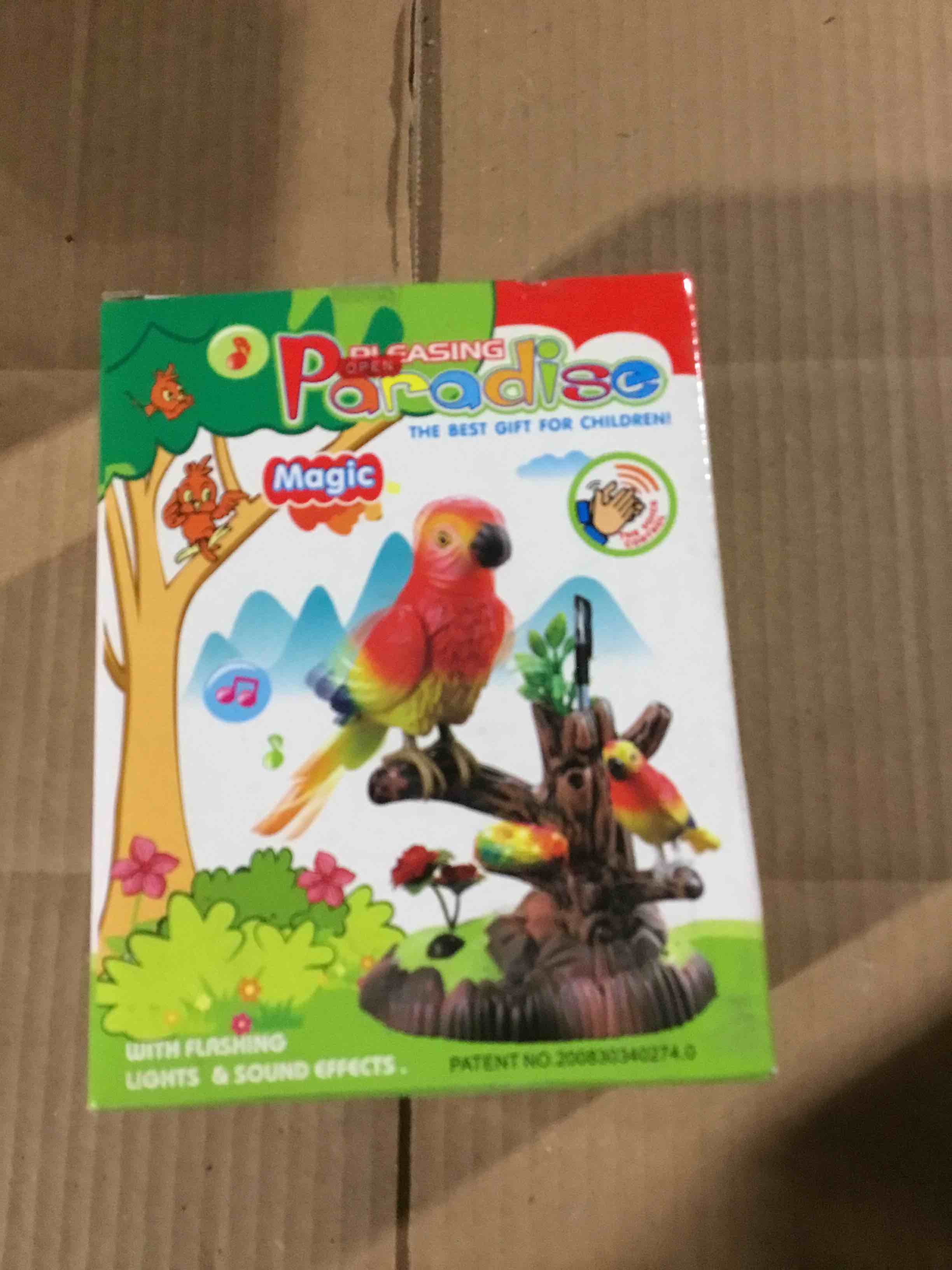Condition photo showing New/Like New for Electronic and interactive parrot toy. the toy works with batteries 