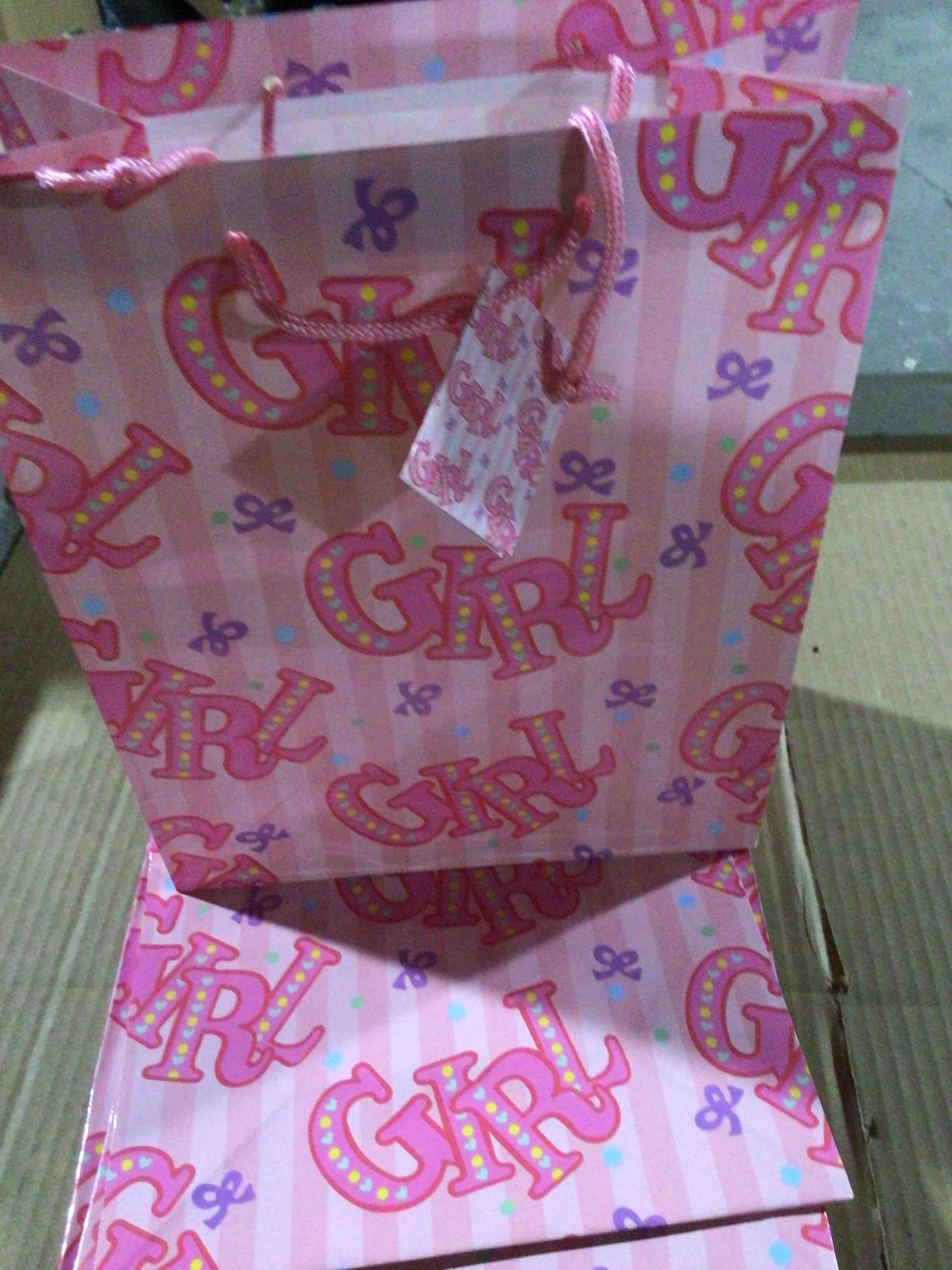 Pink gift bag with print of “ GIRL