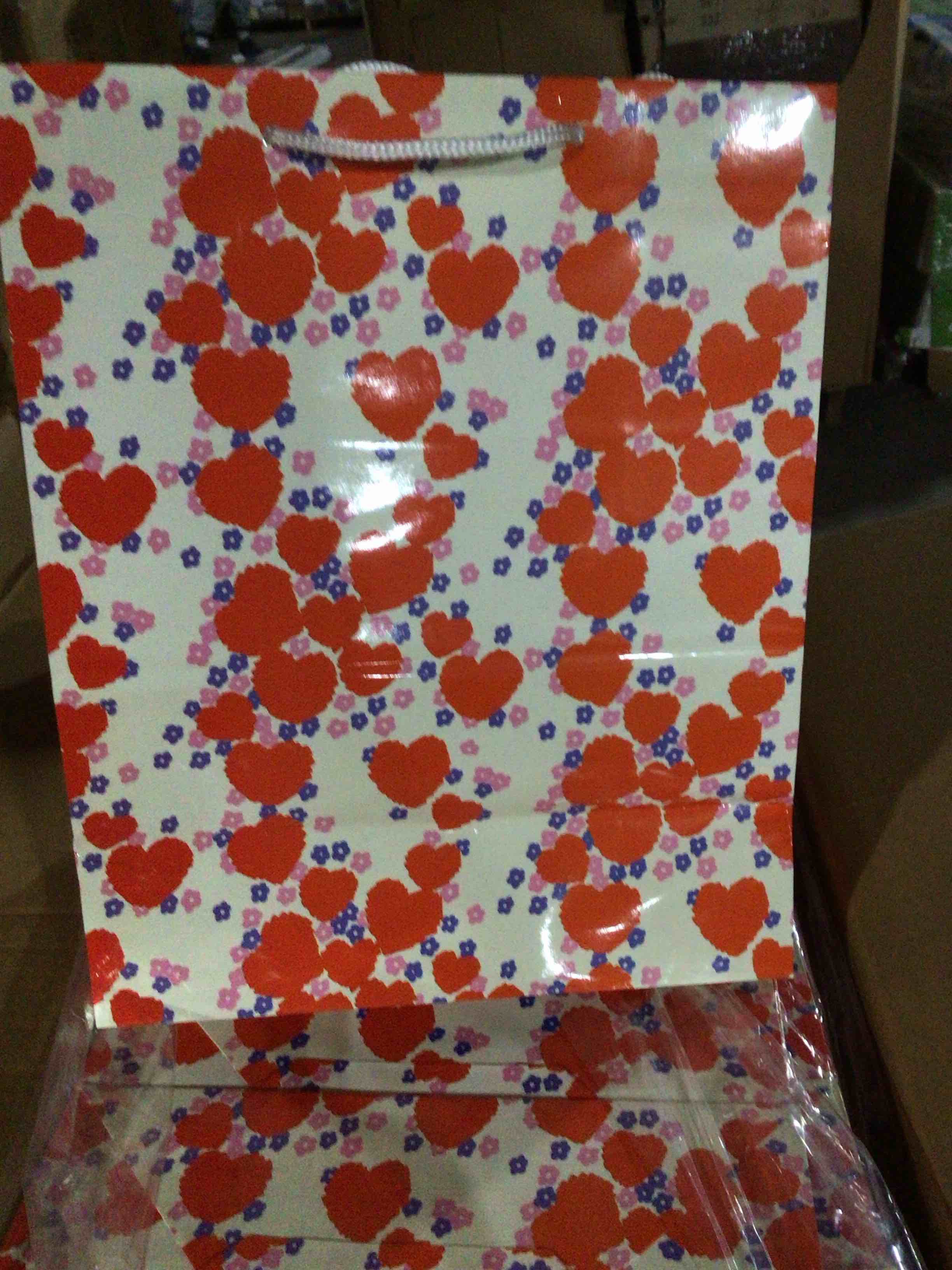 White gift bags with red hearts 
