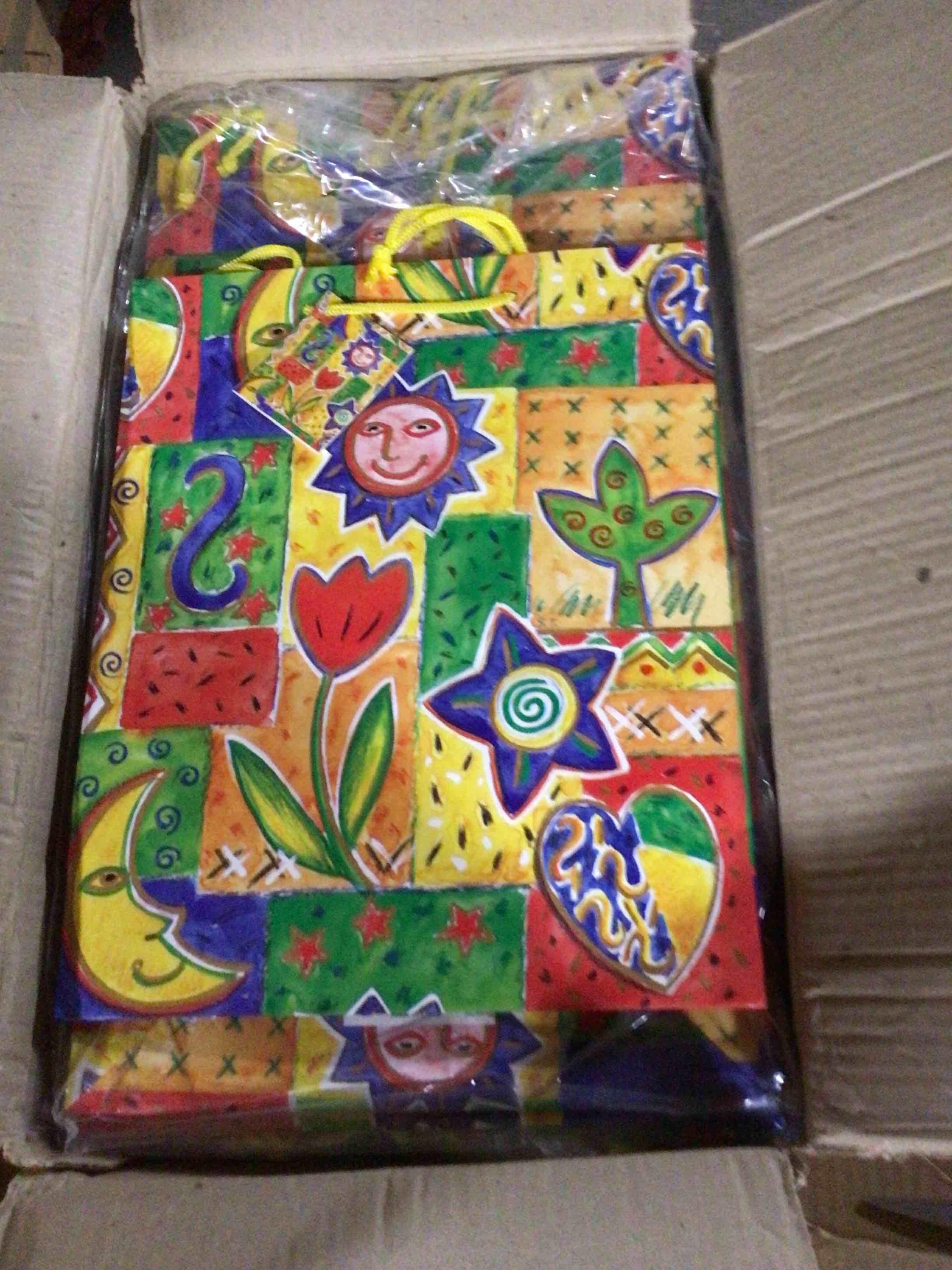 Gift bag with a vibrant artistic design ,which features motifs of so
