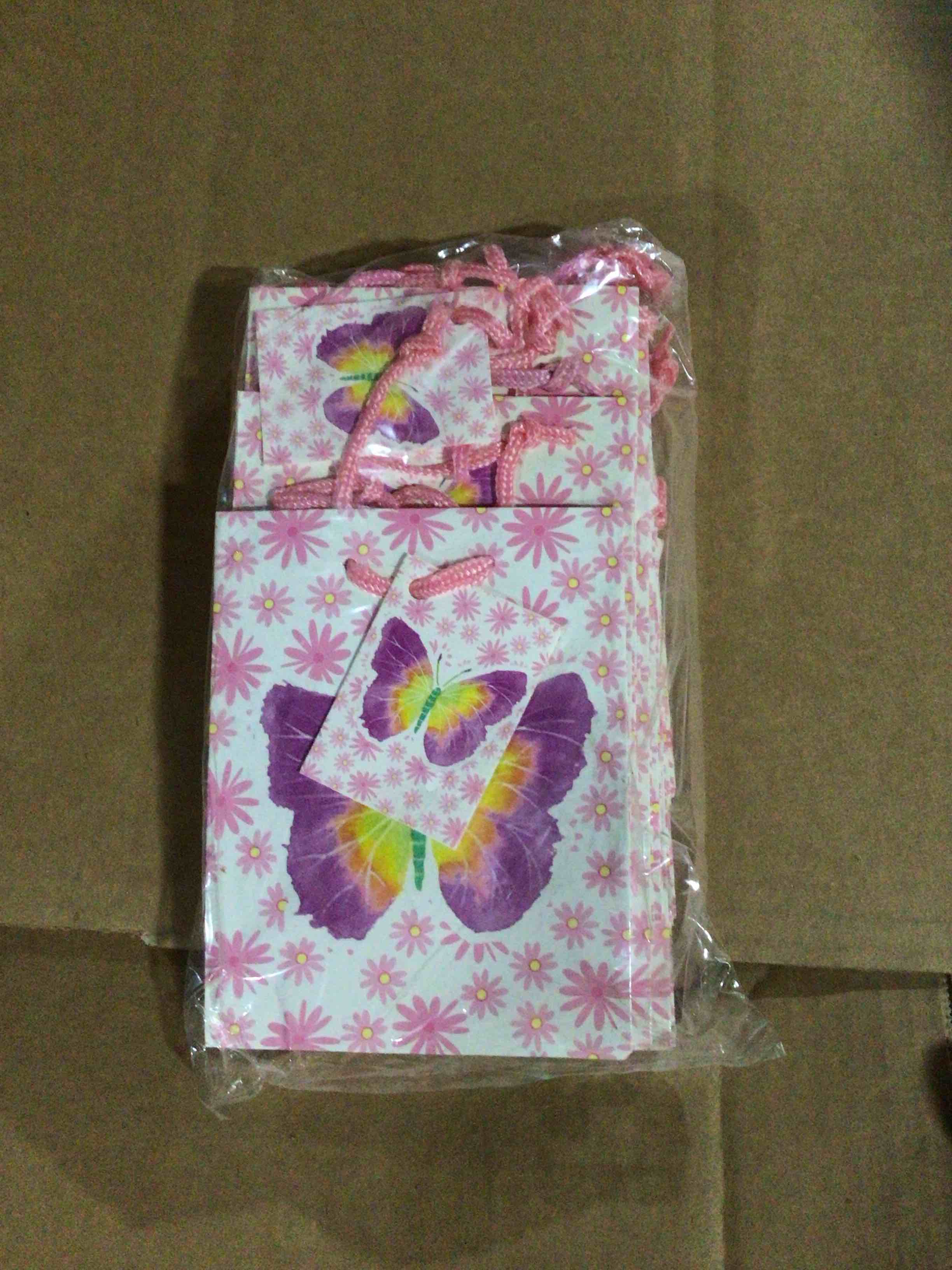 Design with pink and purple daisies and a butterfly print 