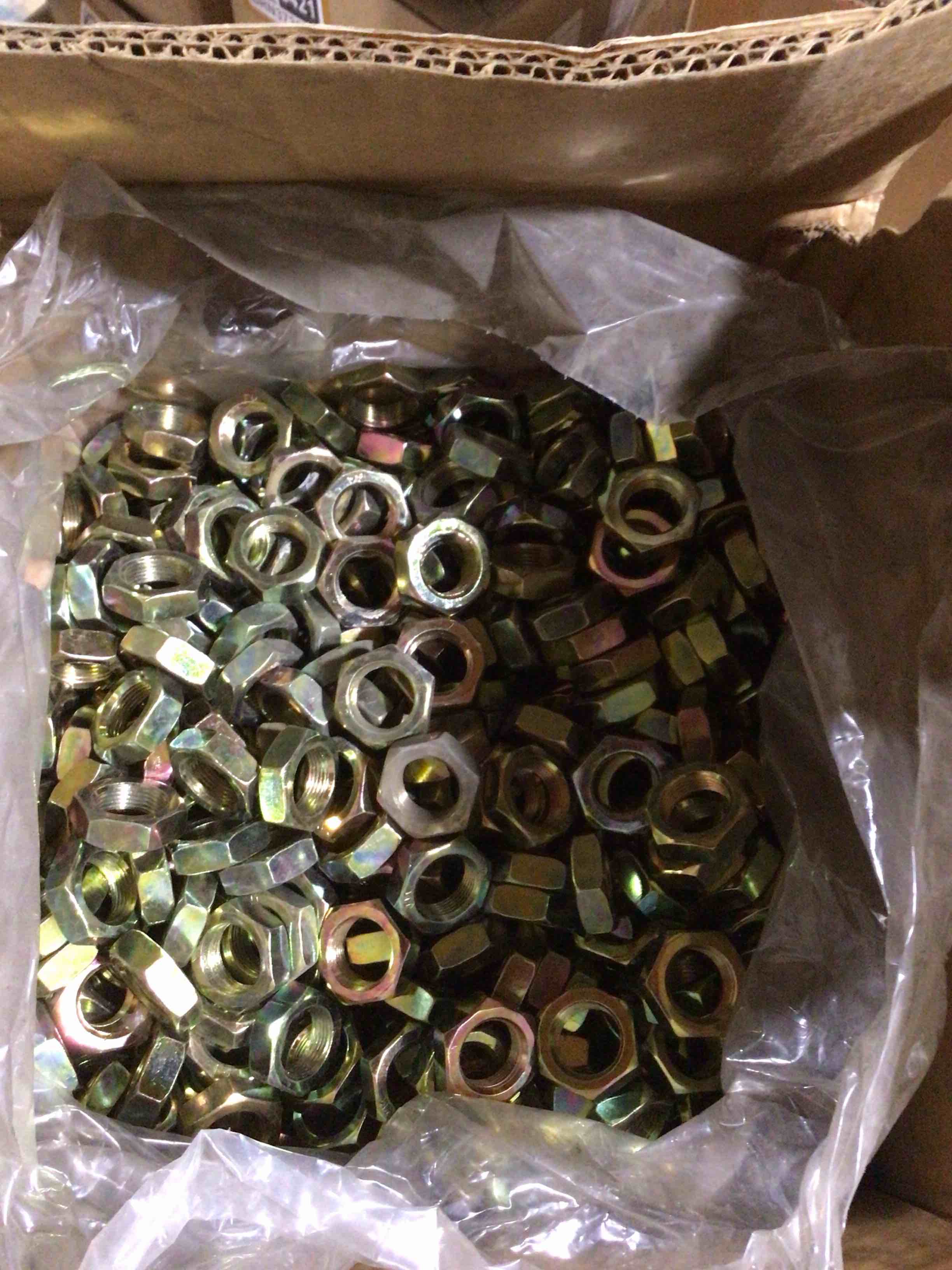 Hex nuts that are probably planted in yellow zinc for greater resistance to corrosion 