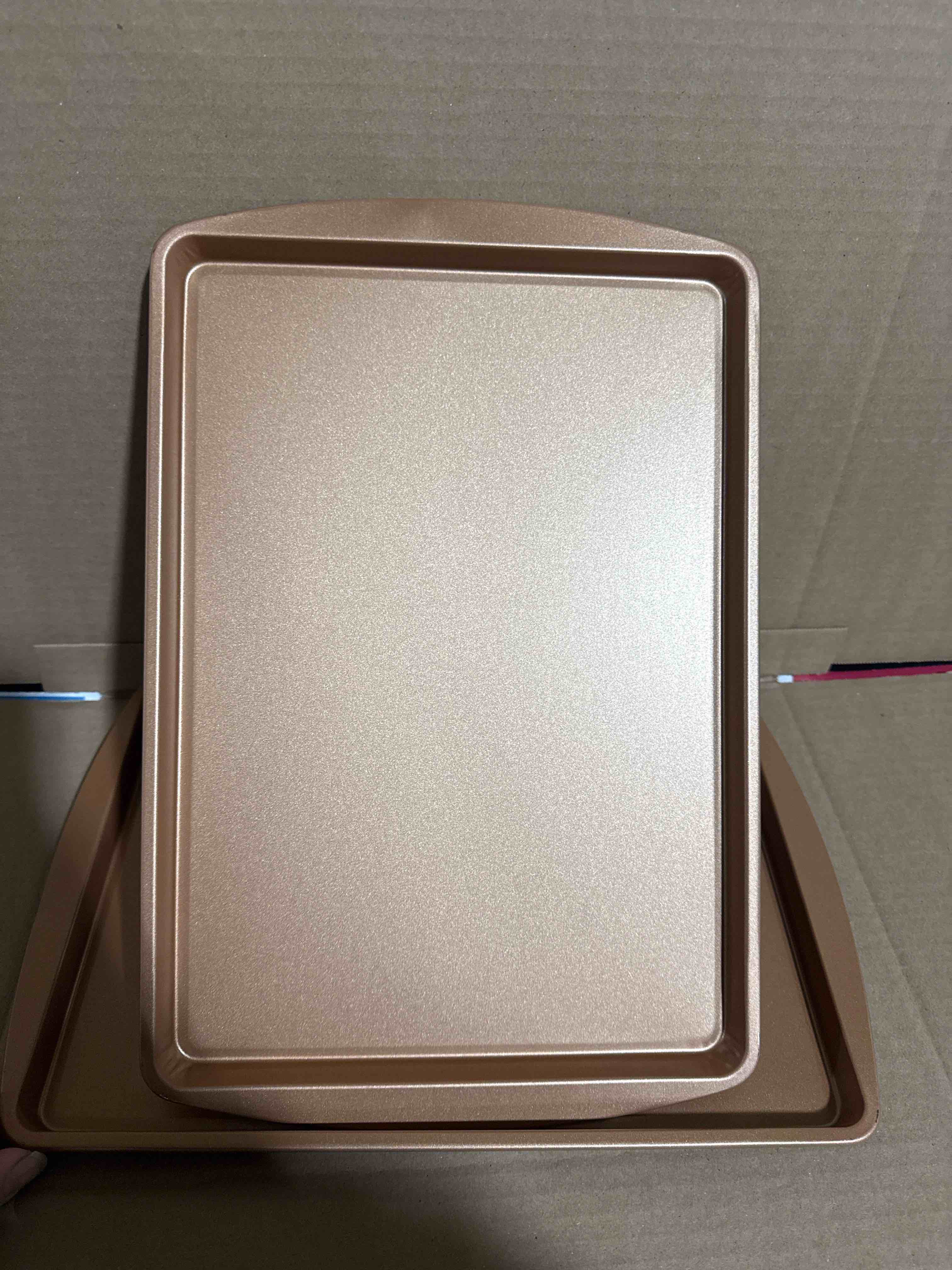 Condition photo showing New/Like New for (set of 2) 15”x9.5” copper cookie sheets 