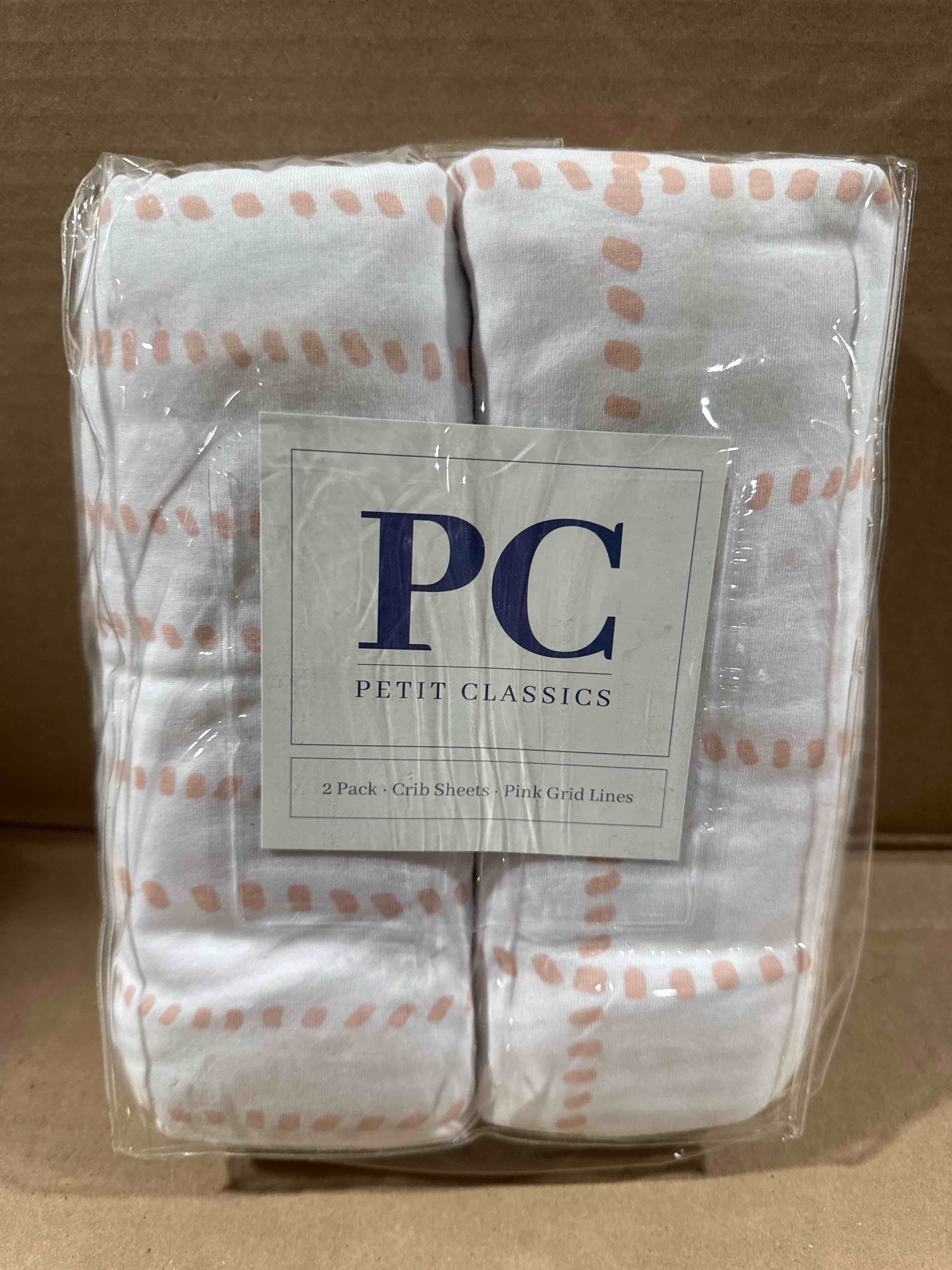 Condition photo showing New/Like New for Petit Classics 2 Pack Crib Sheets Pink Grid 