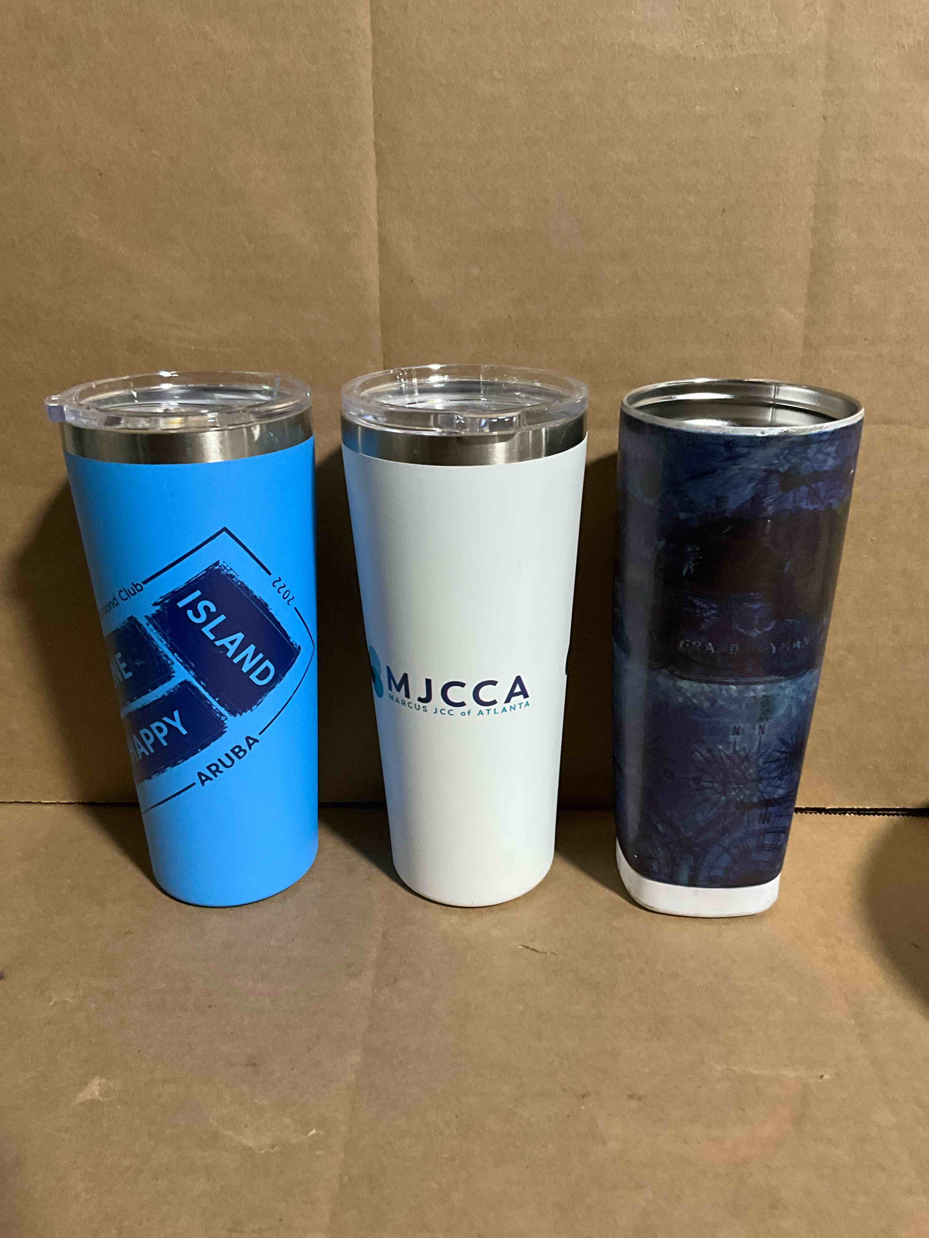Condition photo showing New/Like New for 3 pack of assorted stainless steel tumblers