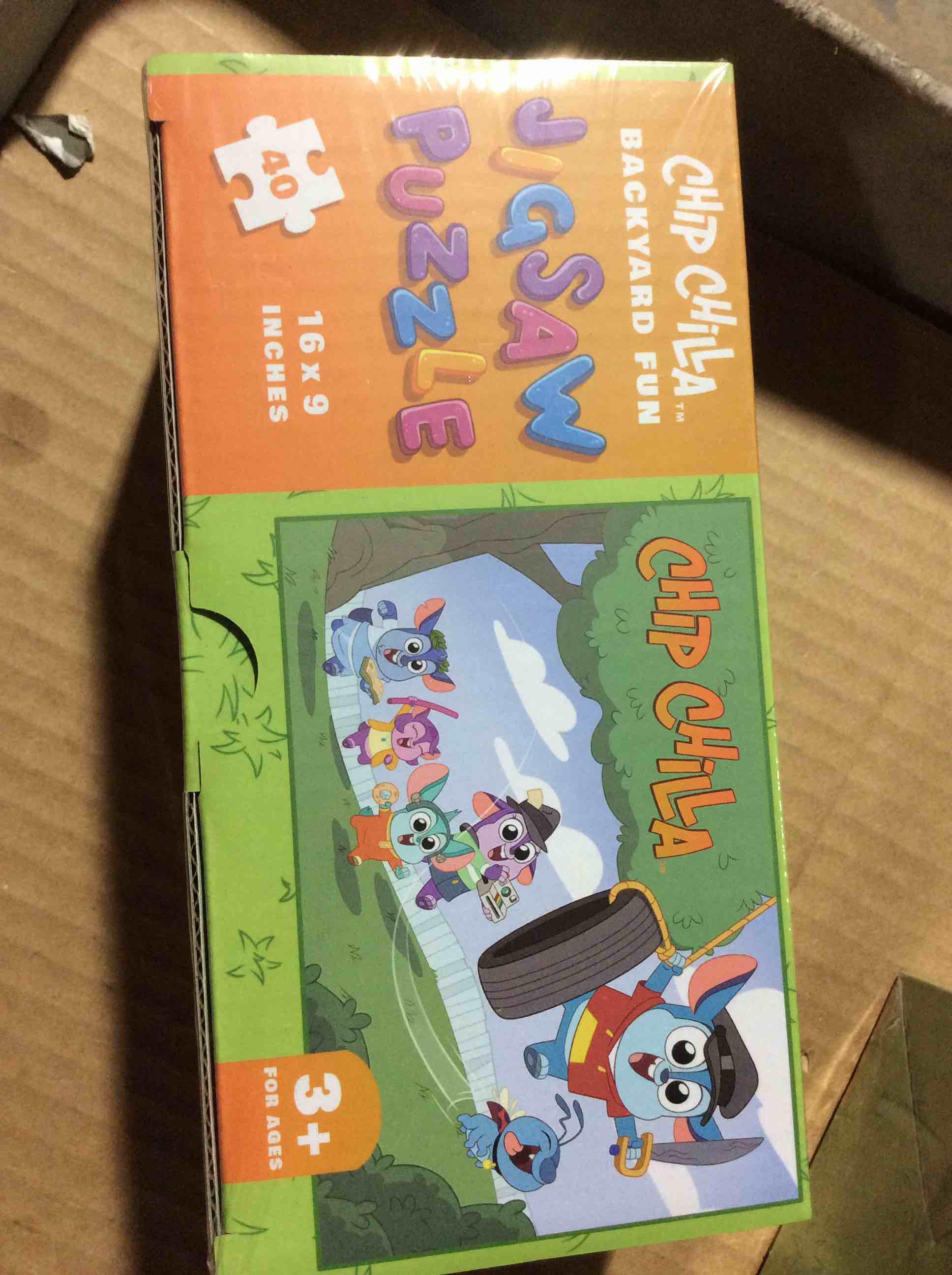 Condition photo showing New/Like New for chip chilla backyard fun jigsaw puzzle16x9