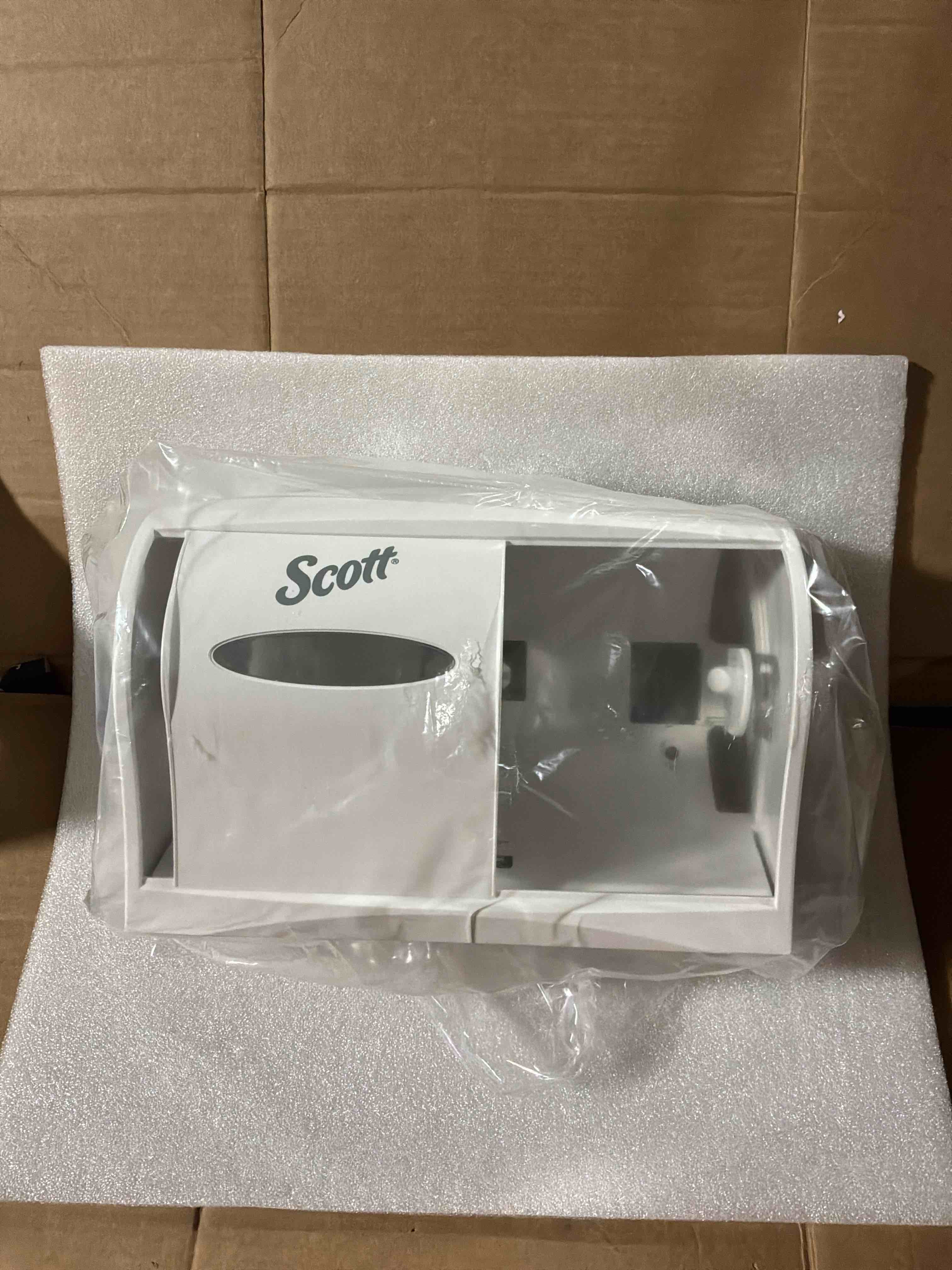 Condition photo showing New/Like New for Scott Essential Coreless SRB Tissue Dispenser