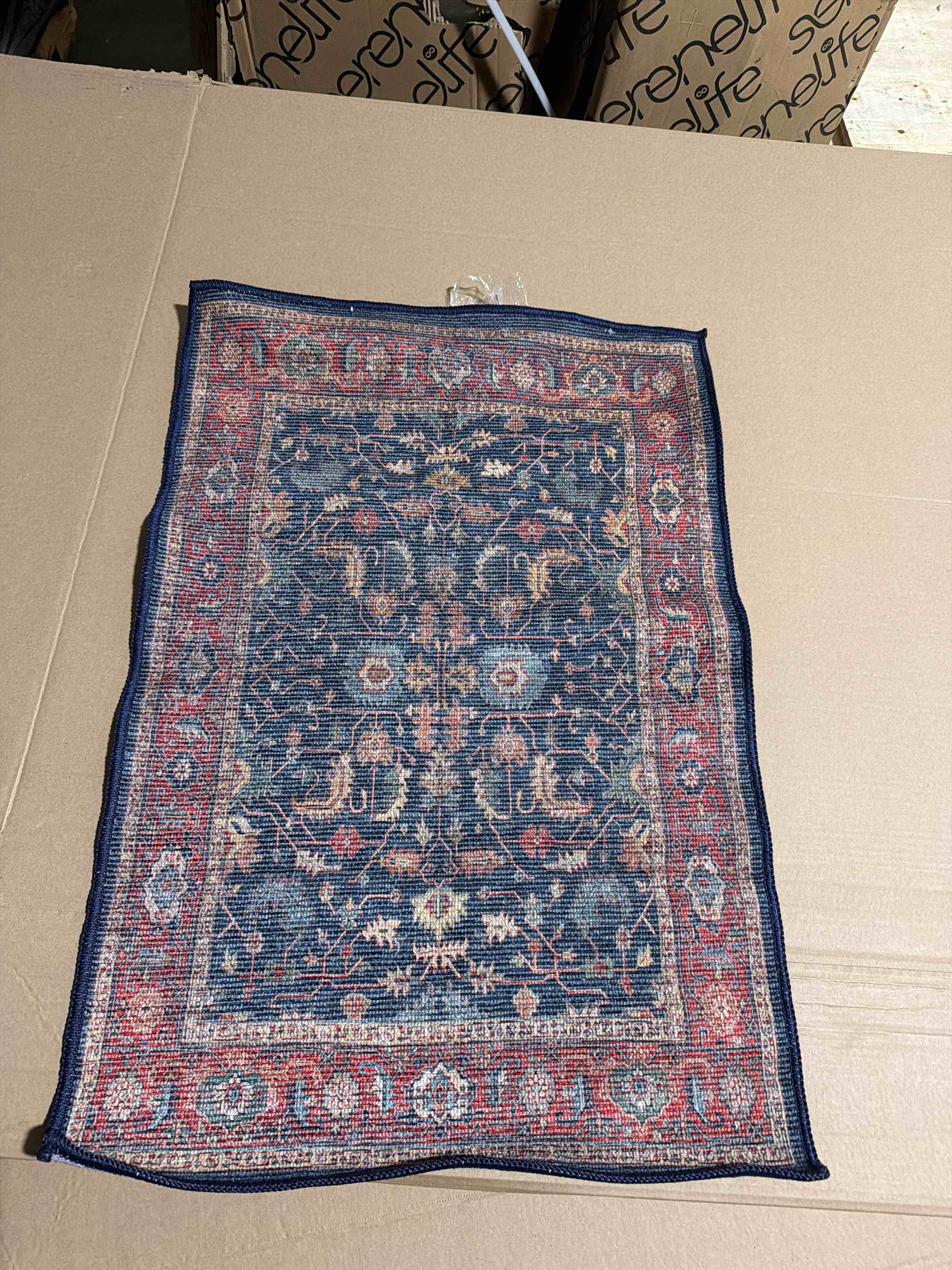 Condition photo showing New/Like New for timeless design cecilia collection area rug navy tierra (2x3)