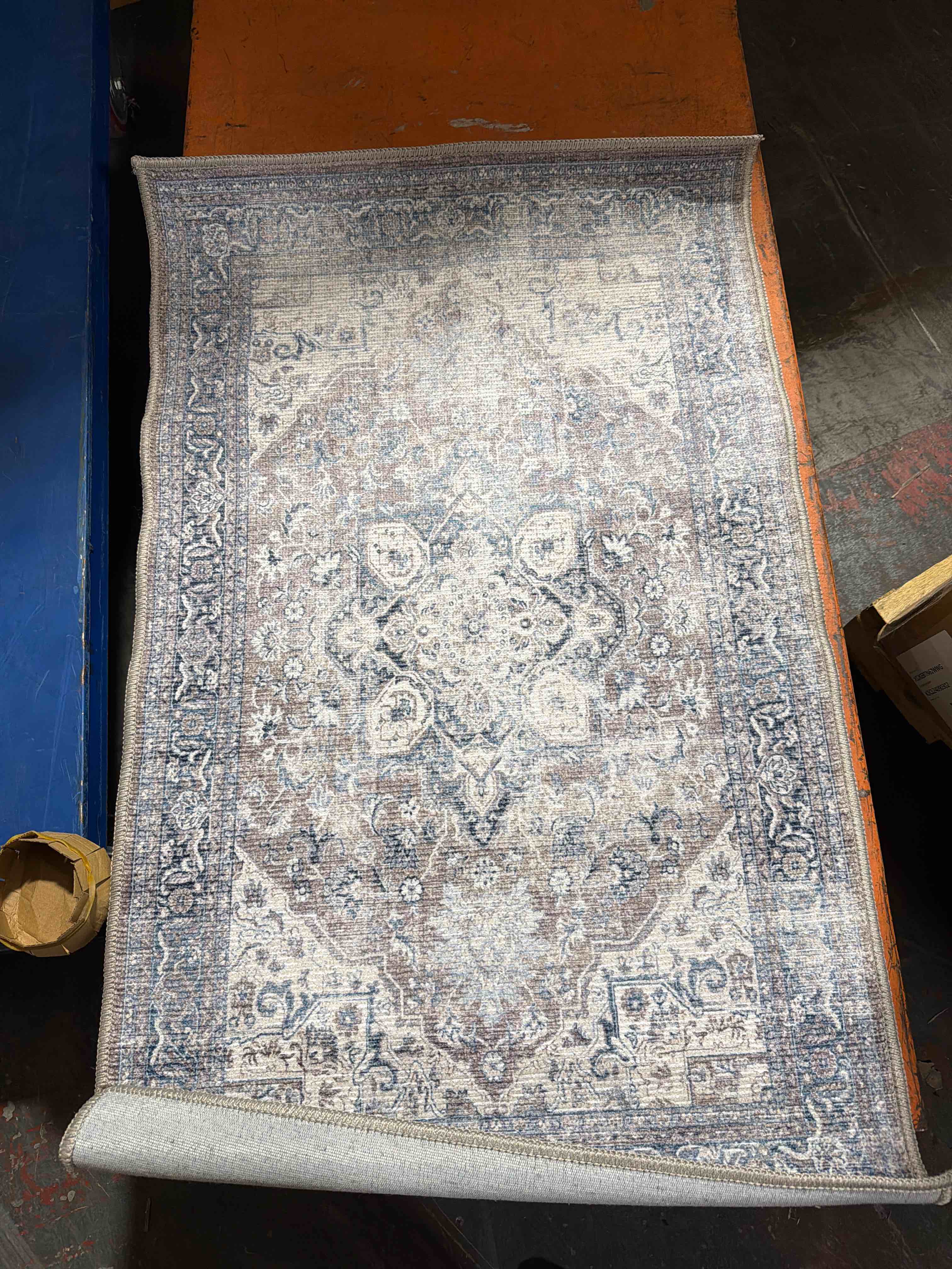 Condition photo showing New/Like New for timeless designs Cecilia II collection area rug brown navy (2’3”X7'3) 