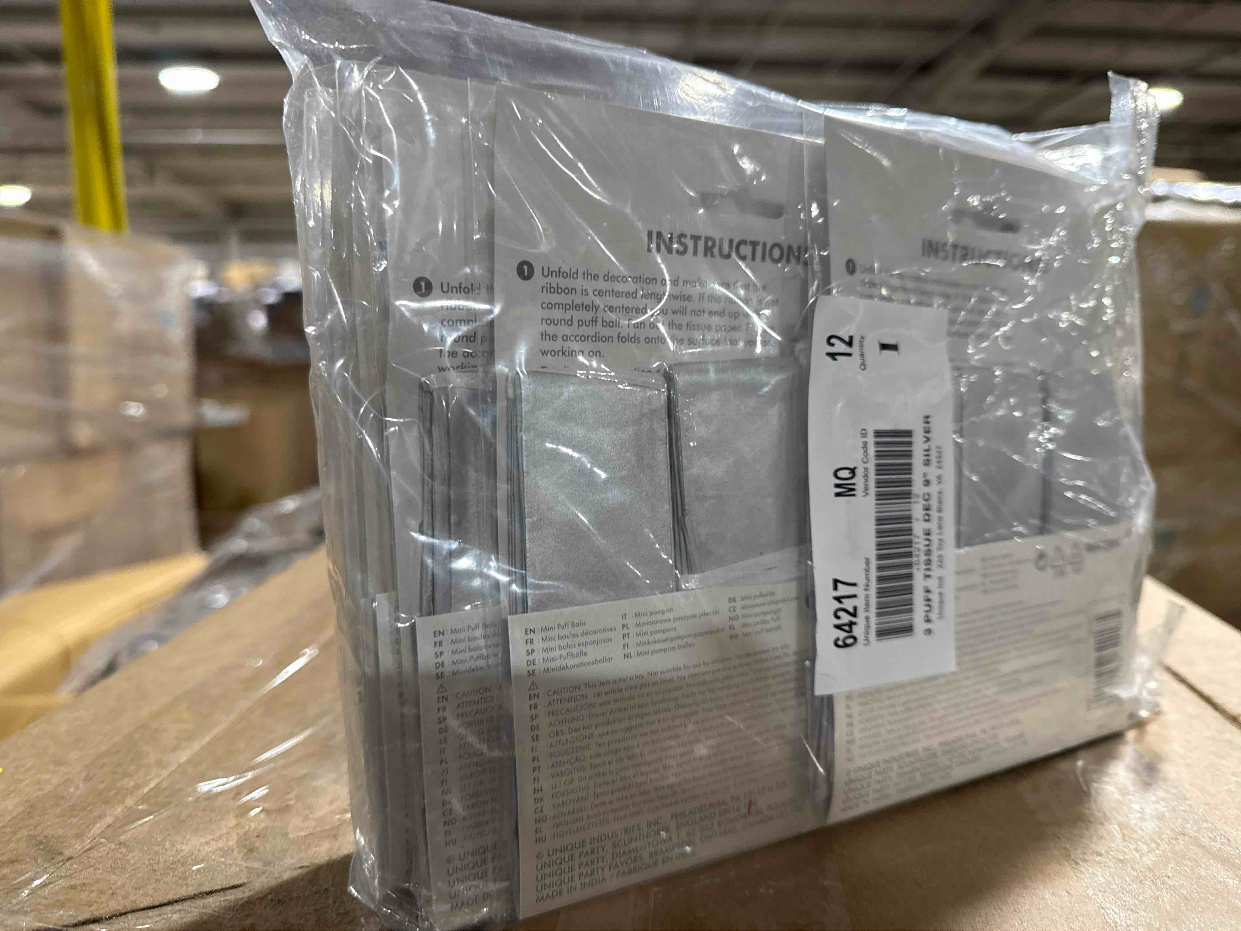 Condition photo showing New/Like New for pack of 12 tissue paper pom poms  9 in  silver  3ct