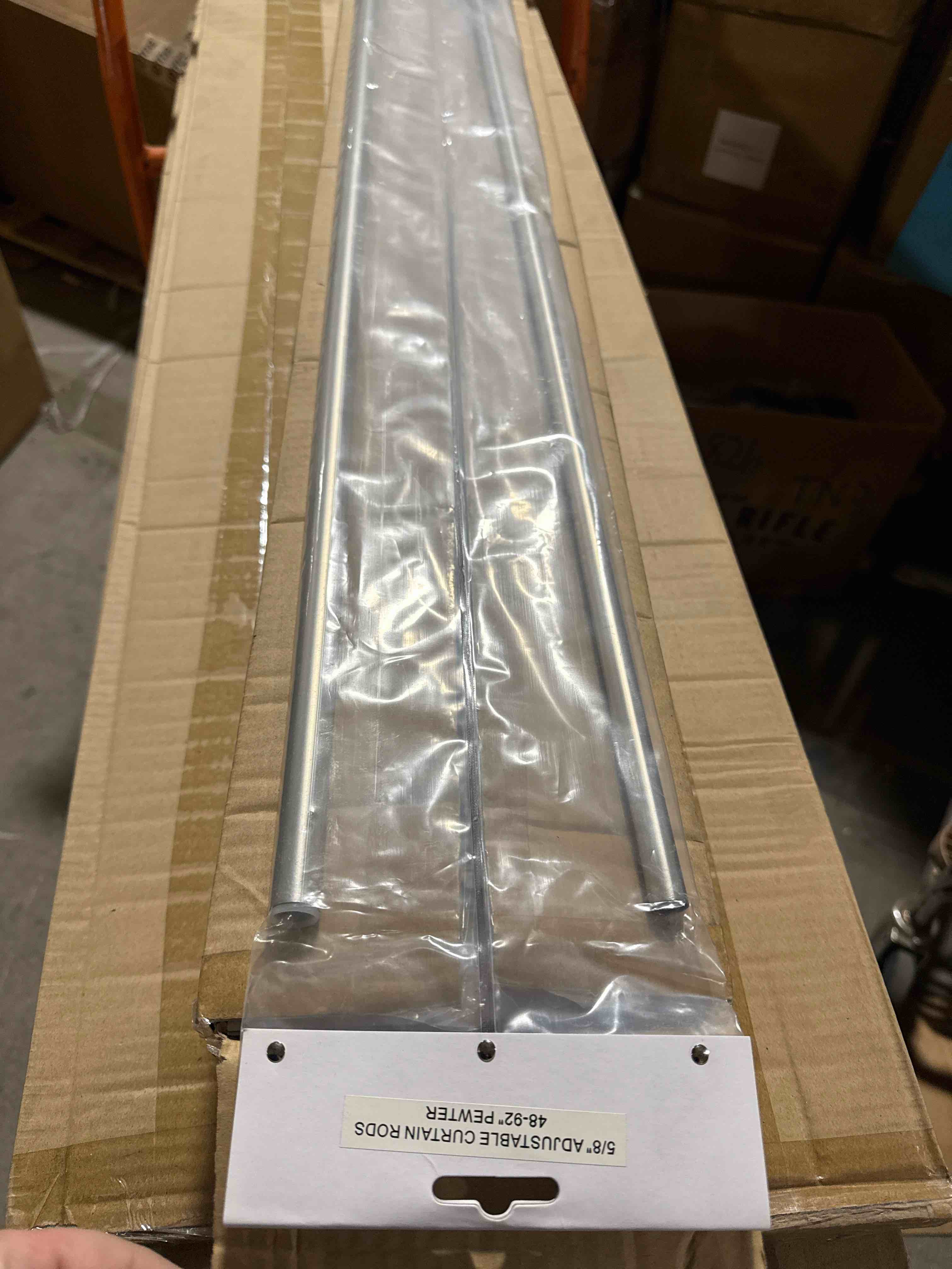 Condition photo showing New/Like New for set of 4 adjustable curtain rod 48” - 92” pewter 