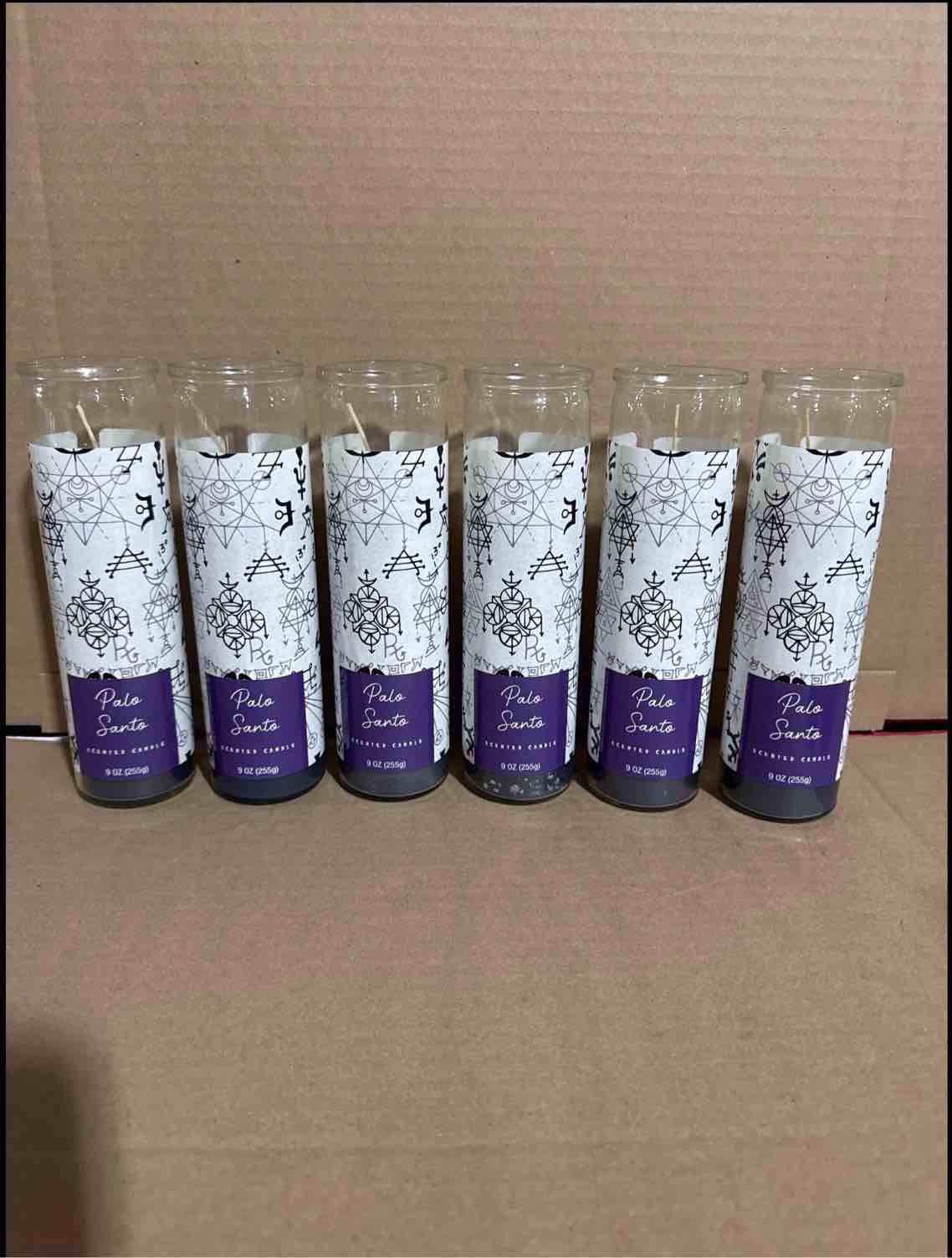Condition photo showing Brand New for case of 6 - 9 ounce palo santo scented candle 