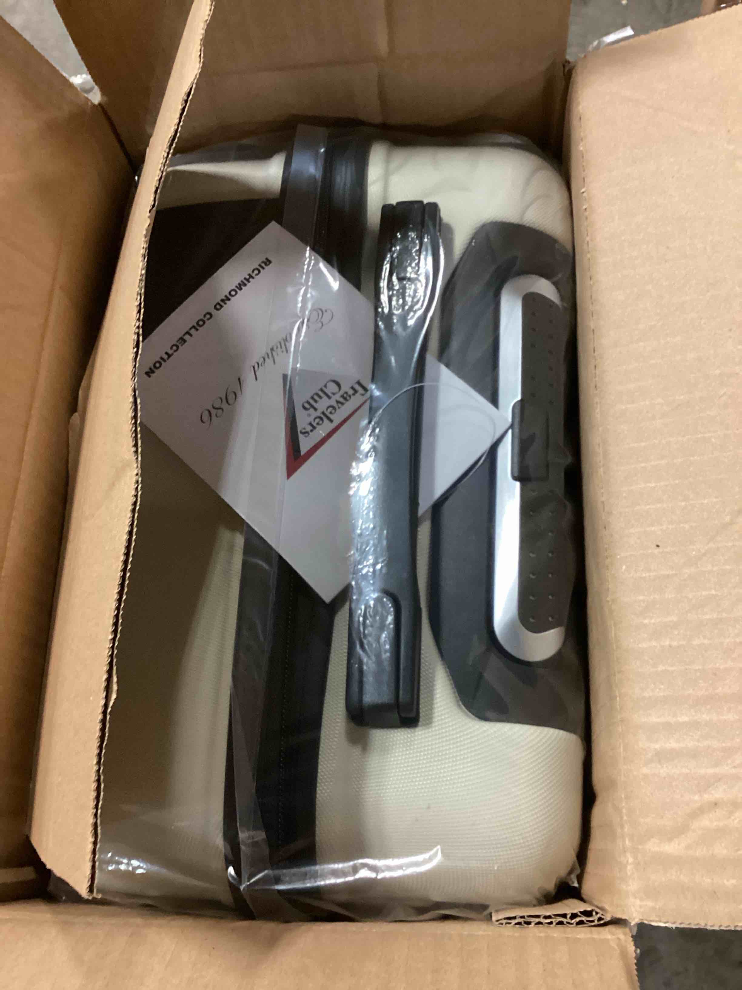 Condition photo showing New/Like New for 20 in. richmond semi-metallic hardside carryon luggage with spinner style wheels