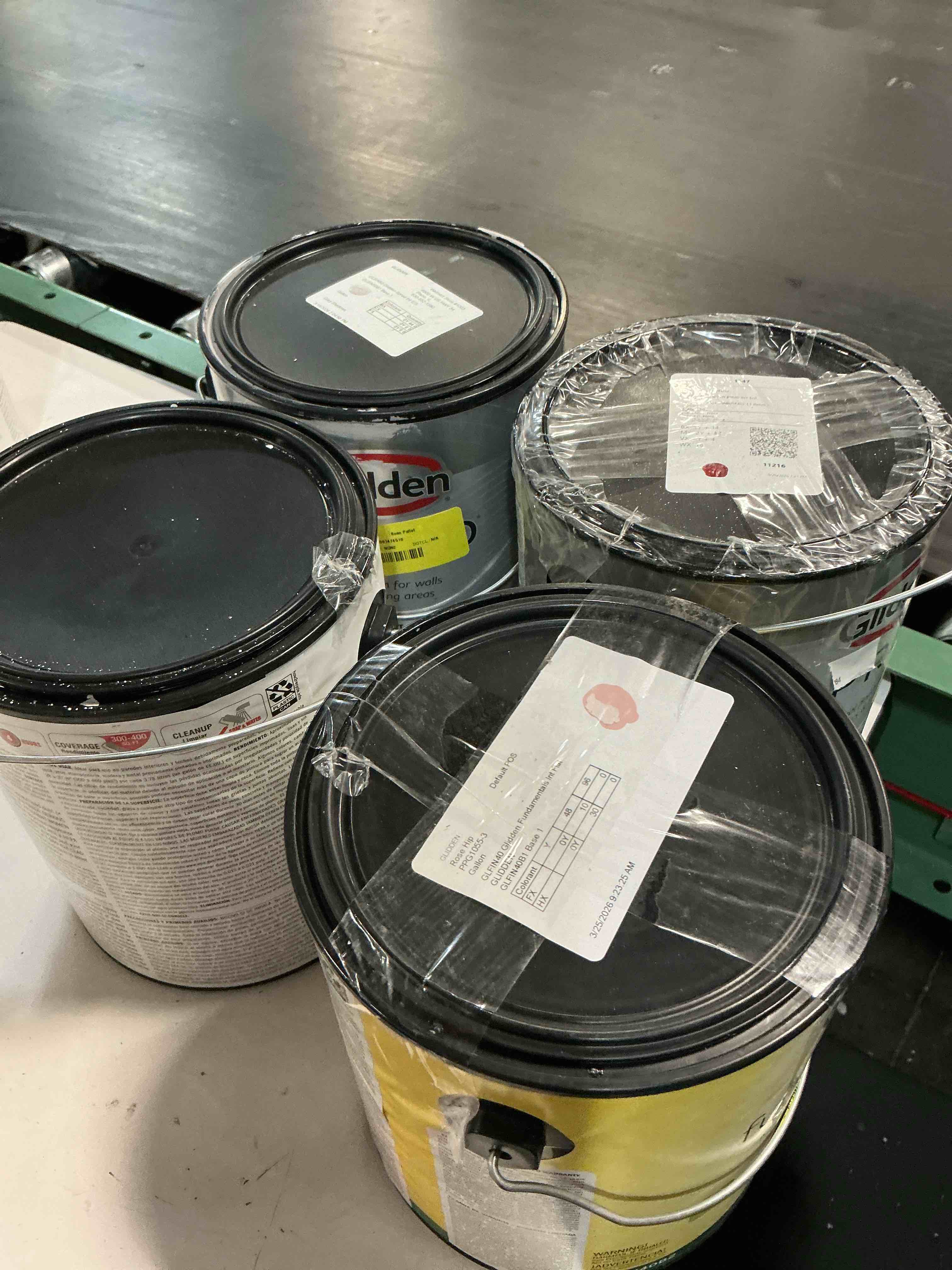 Assorted different cans of exterior and interior house paints different colors