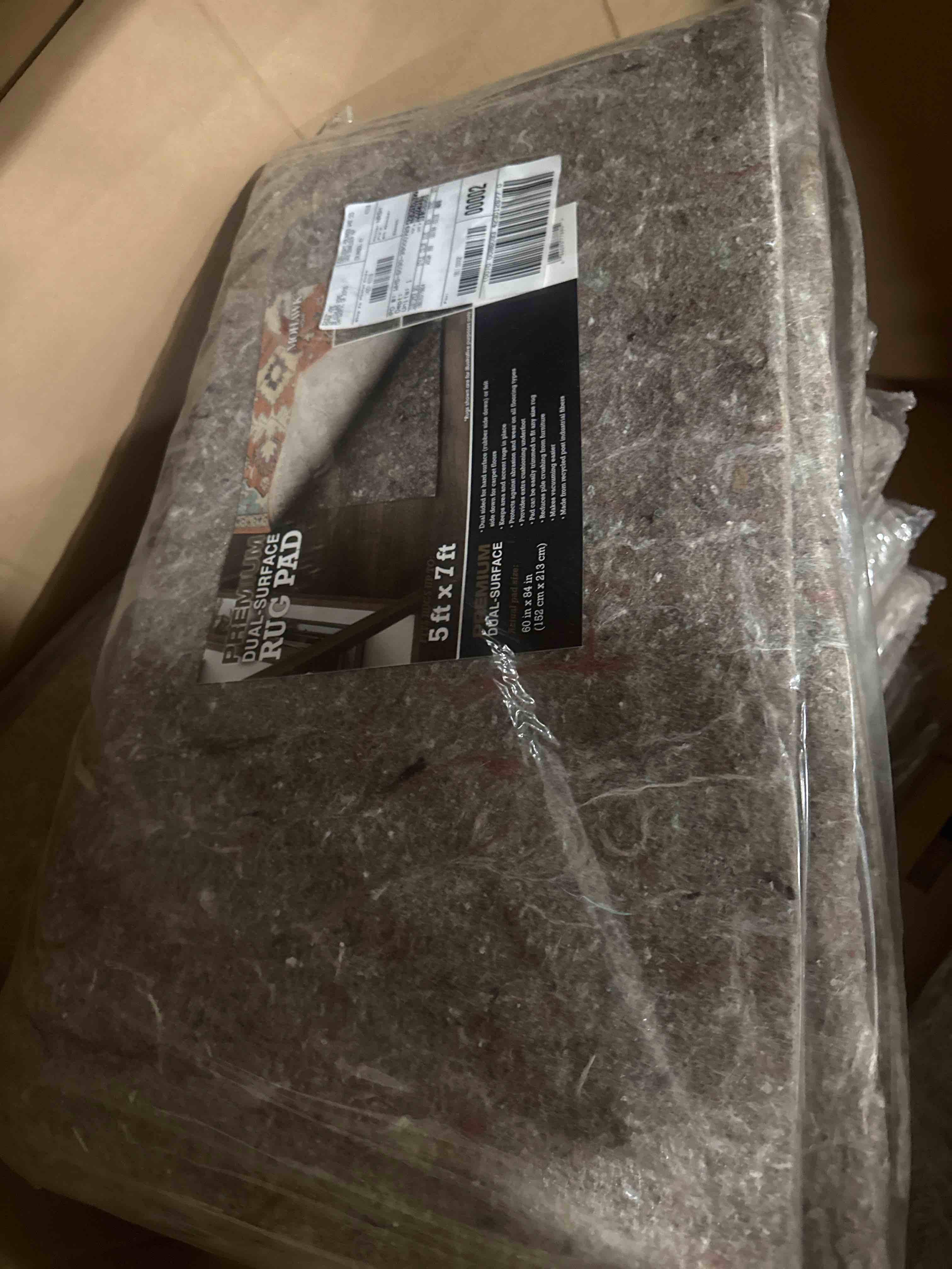 Condition photo showing New/Like New for premium dual surface rug pad 5ft x 7ft