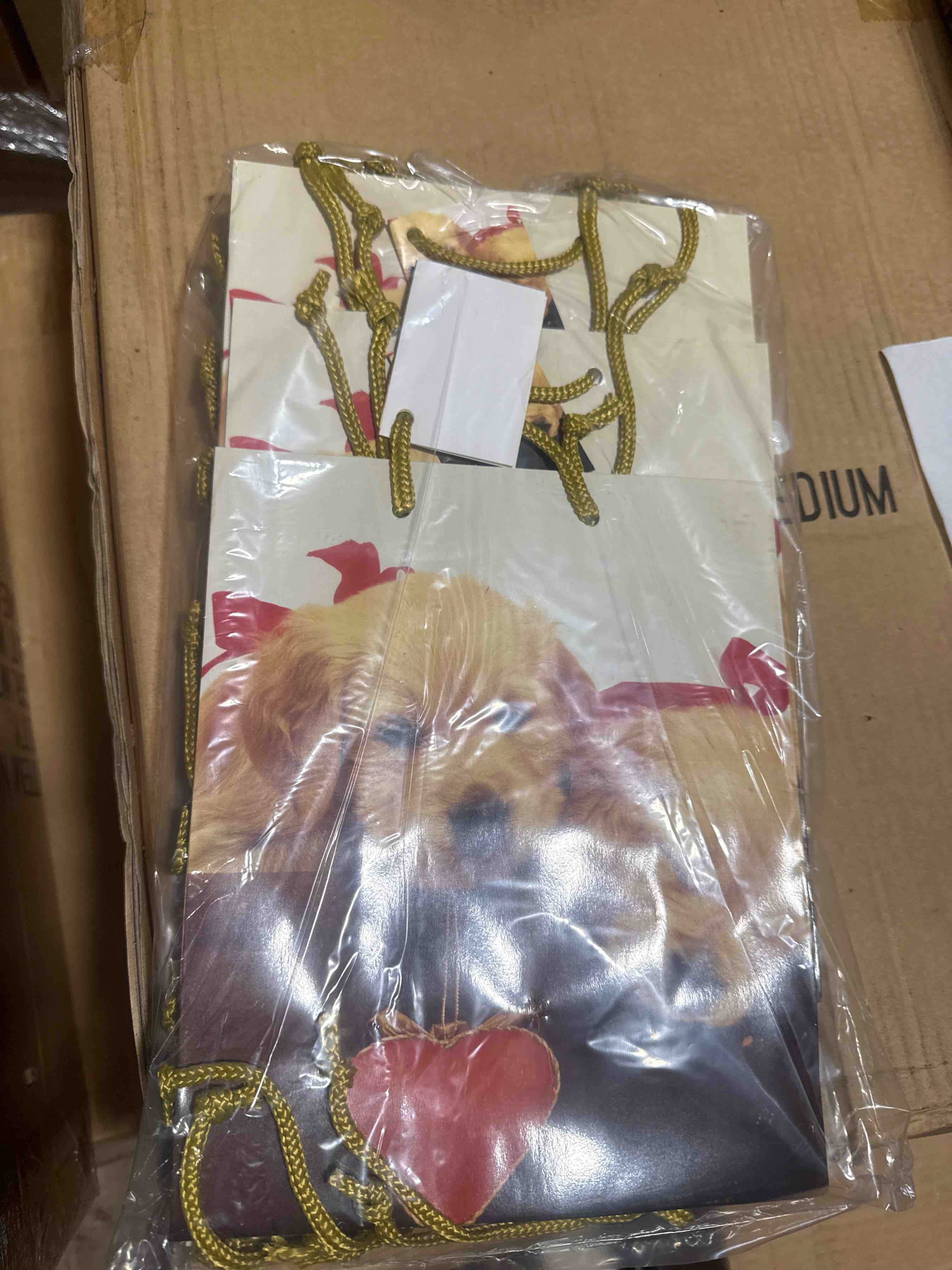 Condition photo showing New/Like New for case of 144 puppy love gift bag 
