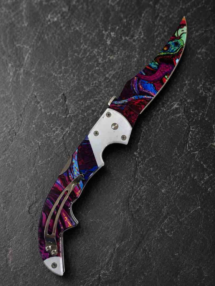 A premium folding pocket knife featuring a vivid multicolor artistic finish, polished stainless steel accents, and a sleek ergonomic design that stands out in any collection.