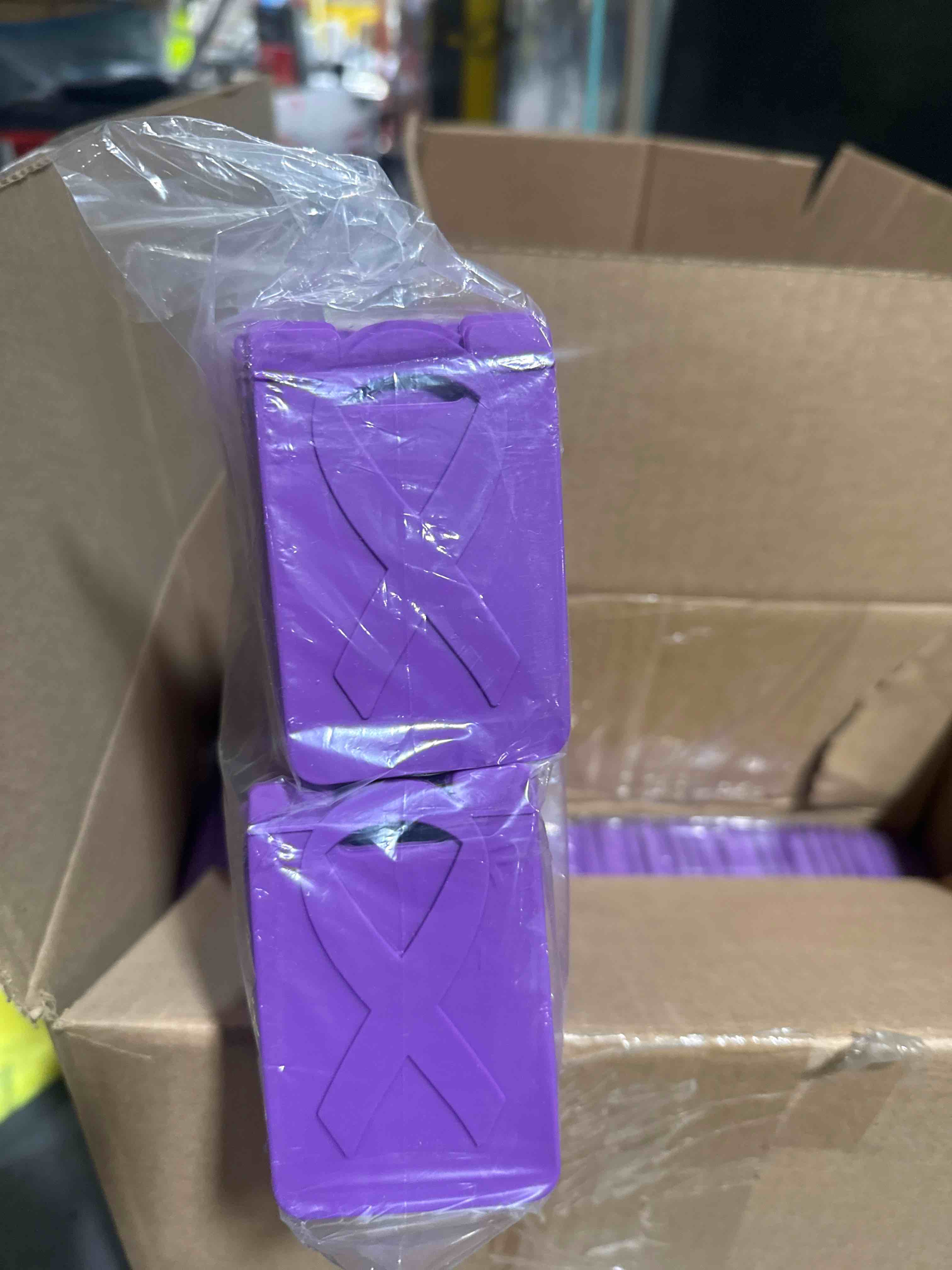 Condition photo showing Brand New for (case of 100) silicone phone wallet featuring an embossed awareness ribbon that securely sticks to the back of your phone to conveniently hold one credit card or id.