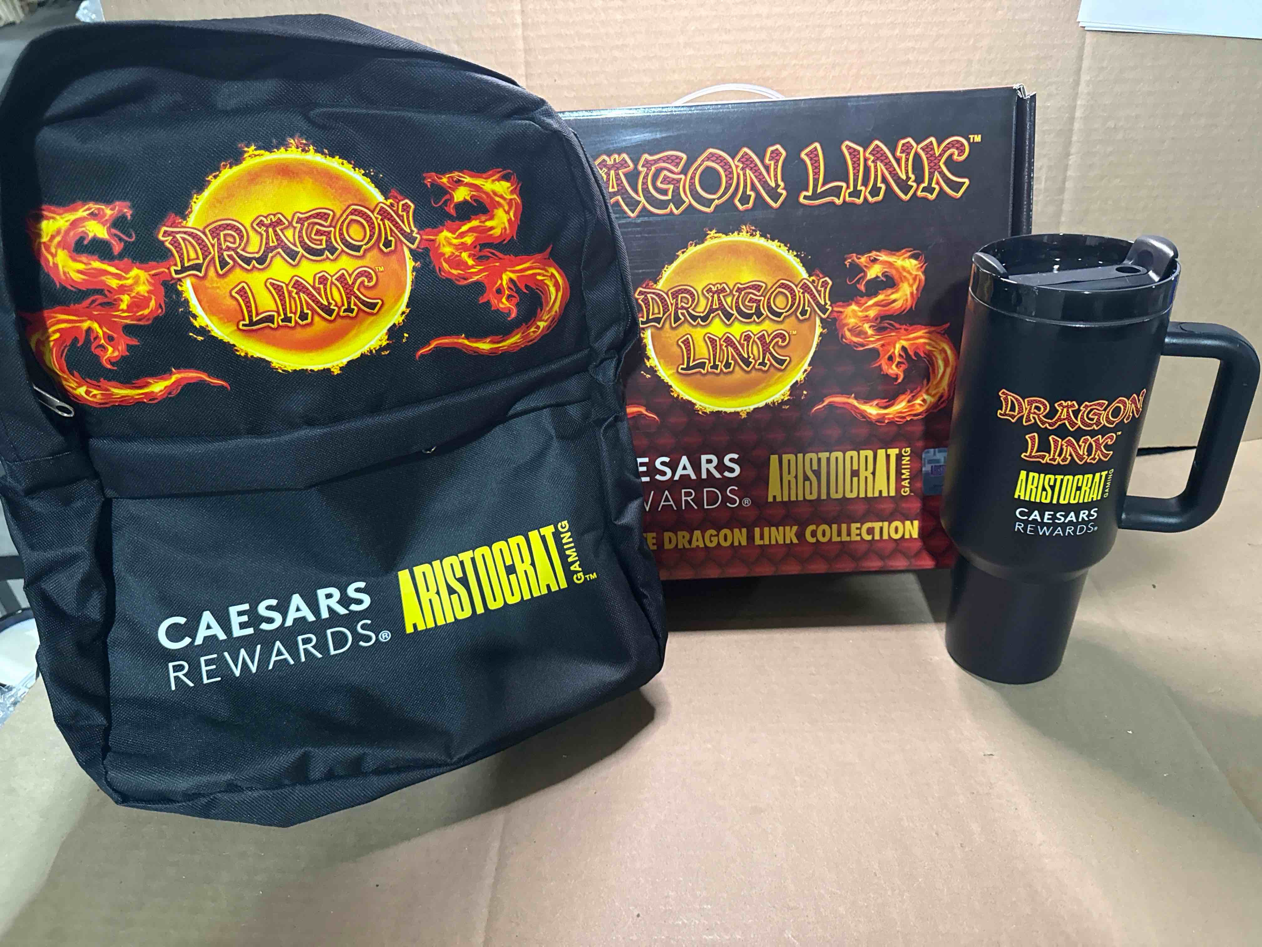 Condition photo showing New/Like New for dragon link caesar rewards gift box backpack and tumblr set