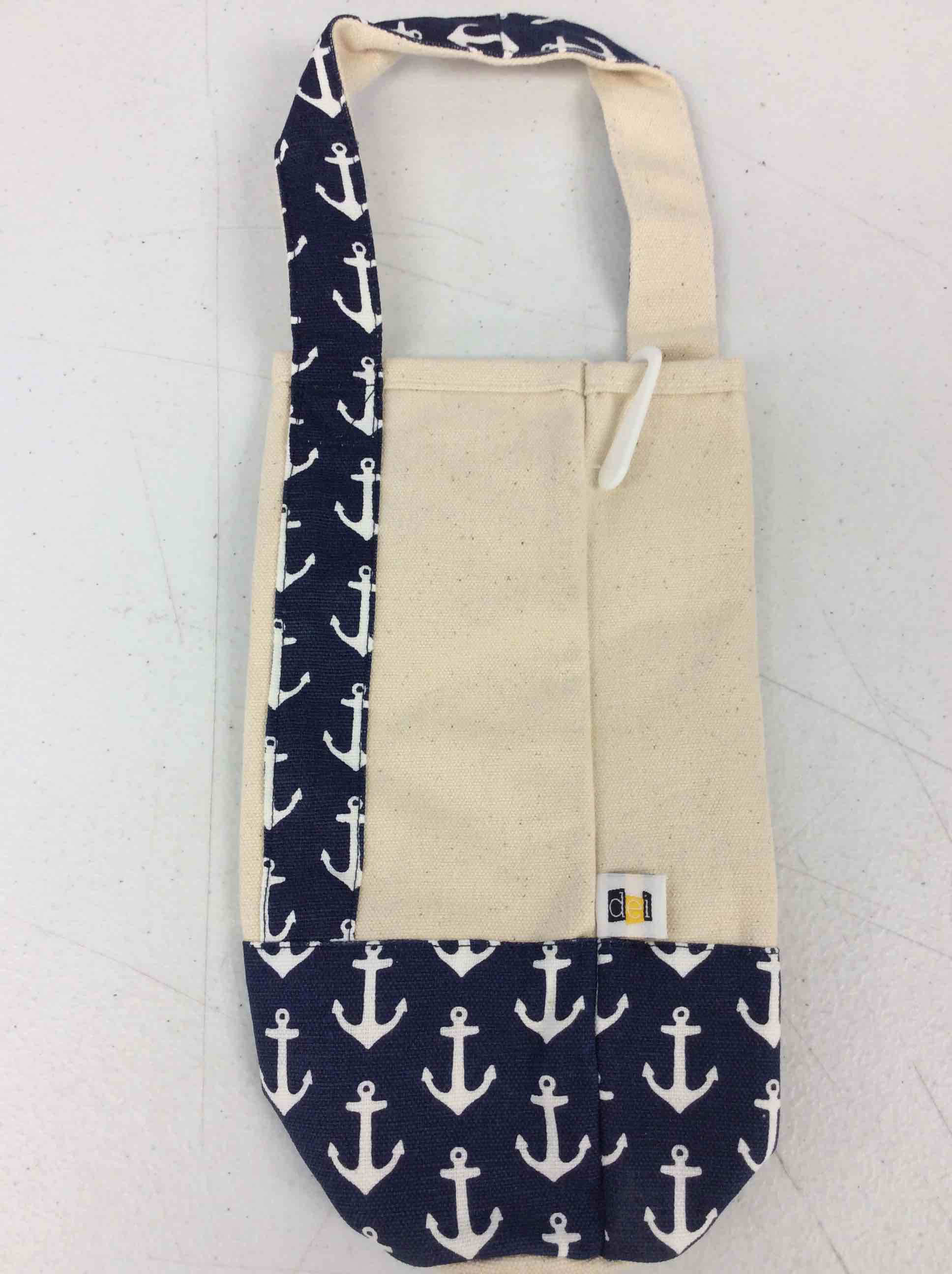 Condition photo showing New/Like New for dei ivory and navy sailor pouches with anchor design