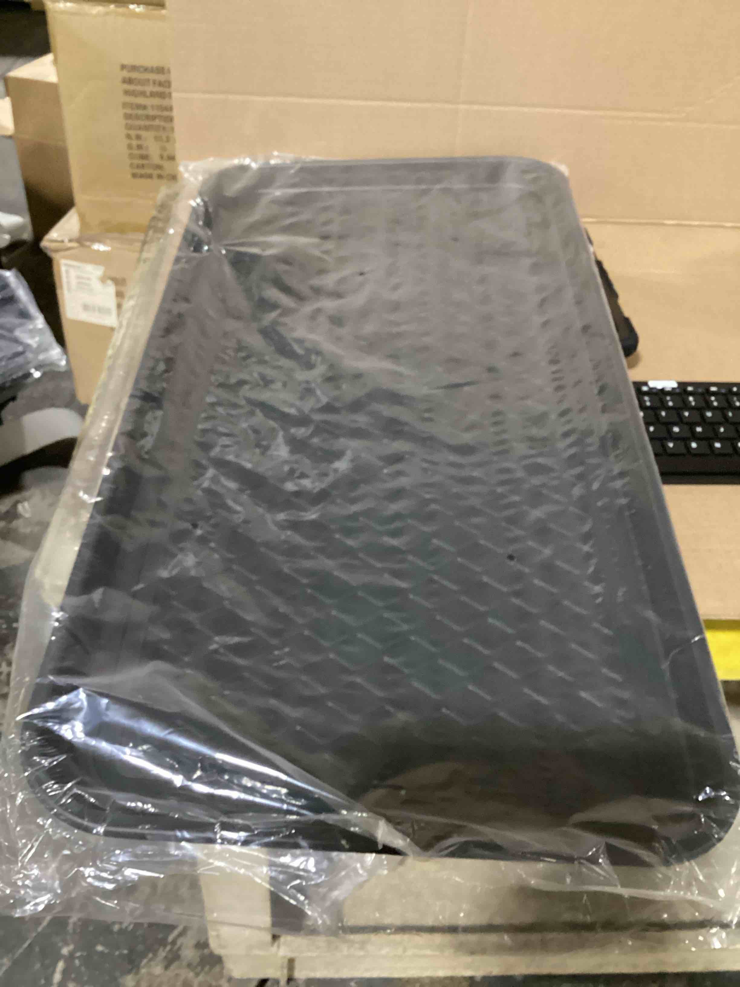Condition photo showing New/Like New for heavy-duty multi-purpose utility tray with raised edges and a non-slip textured surface designed to contain spills and keep items secure.