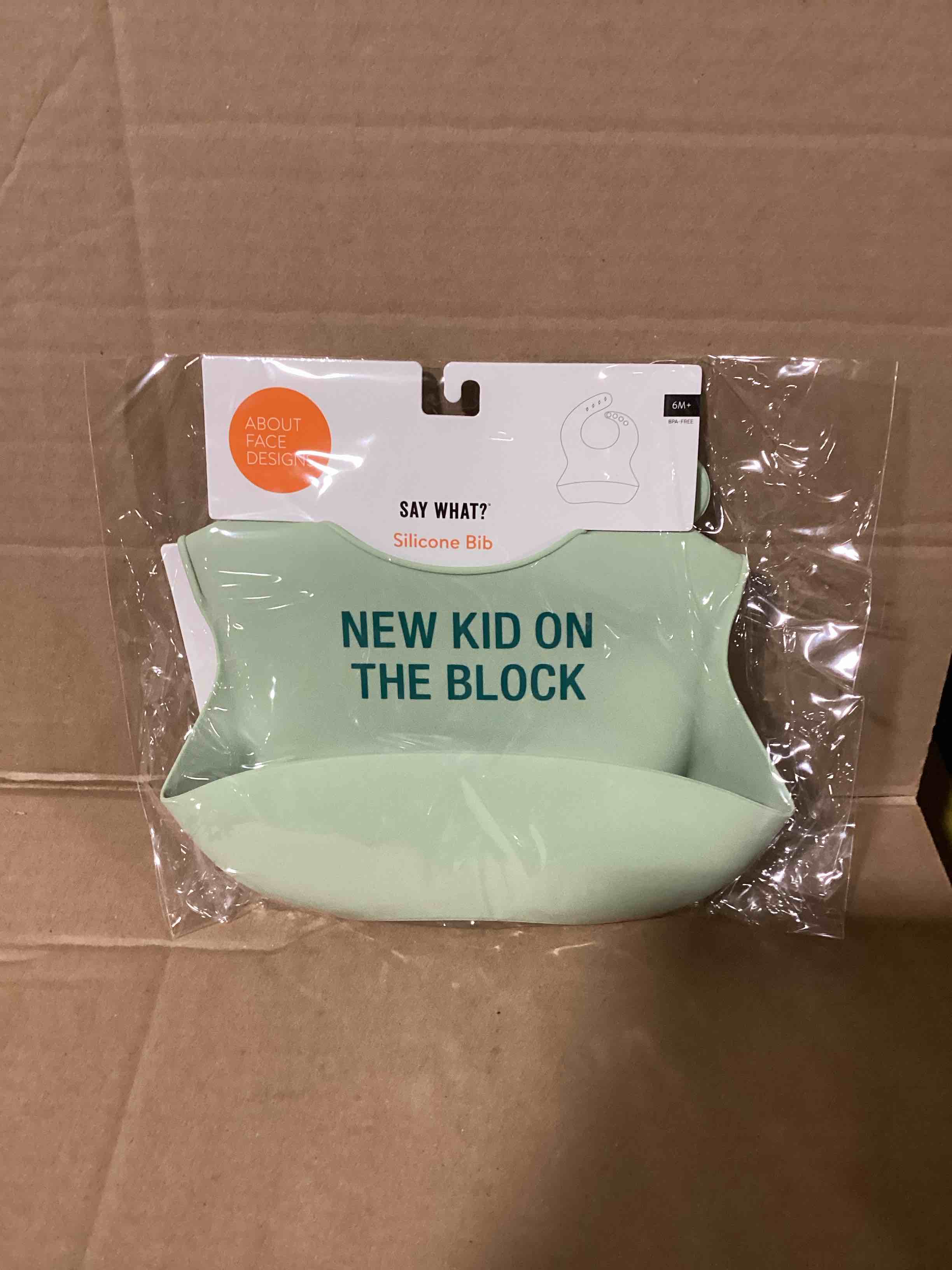 Condition photo showing New/Like New for new kid on the block silicone bib