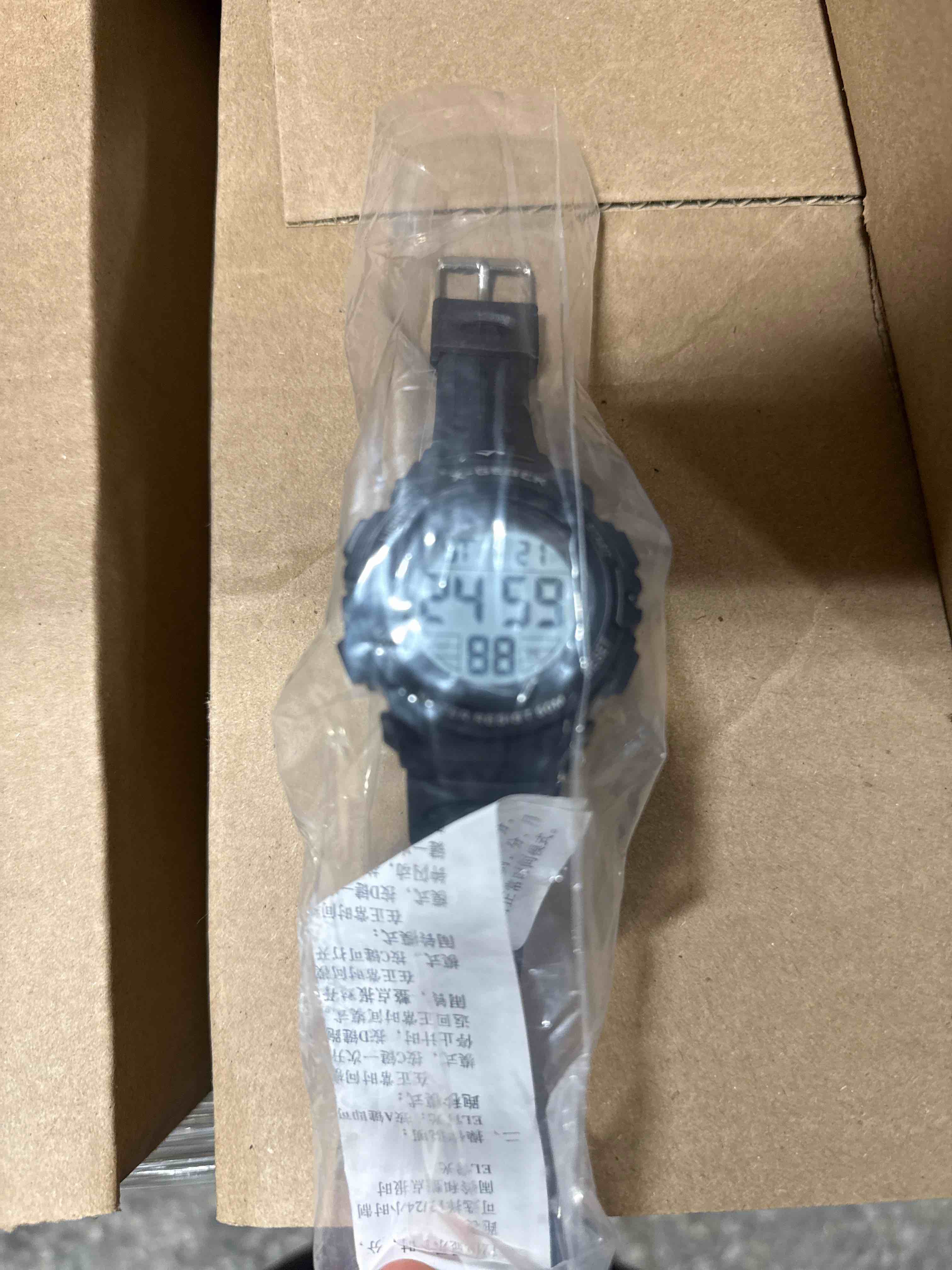 Condition photo showing Brand New for this rugged digital sports watch features a durable black resin band, easy-to-read backlit display, stopwatch and alarm functions, and 50-meter water resistance for everyday wear and outdoor activities.