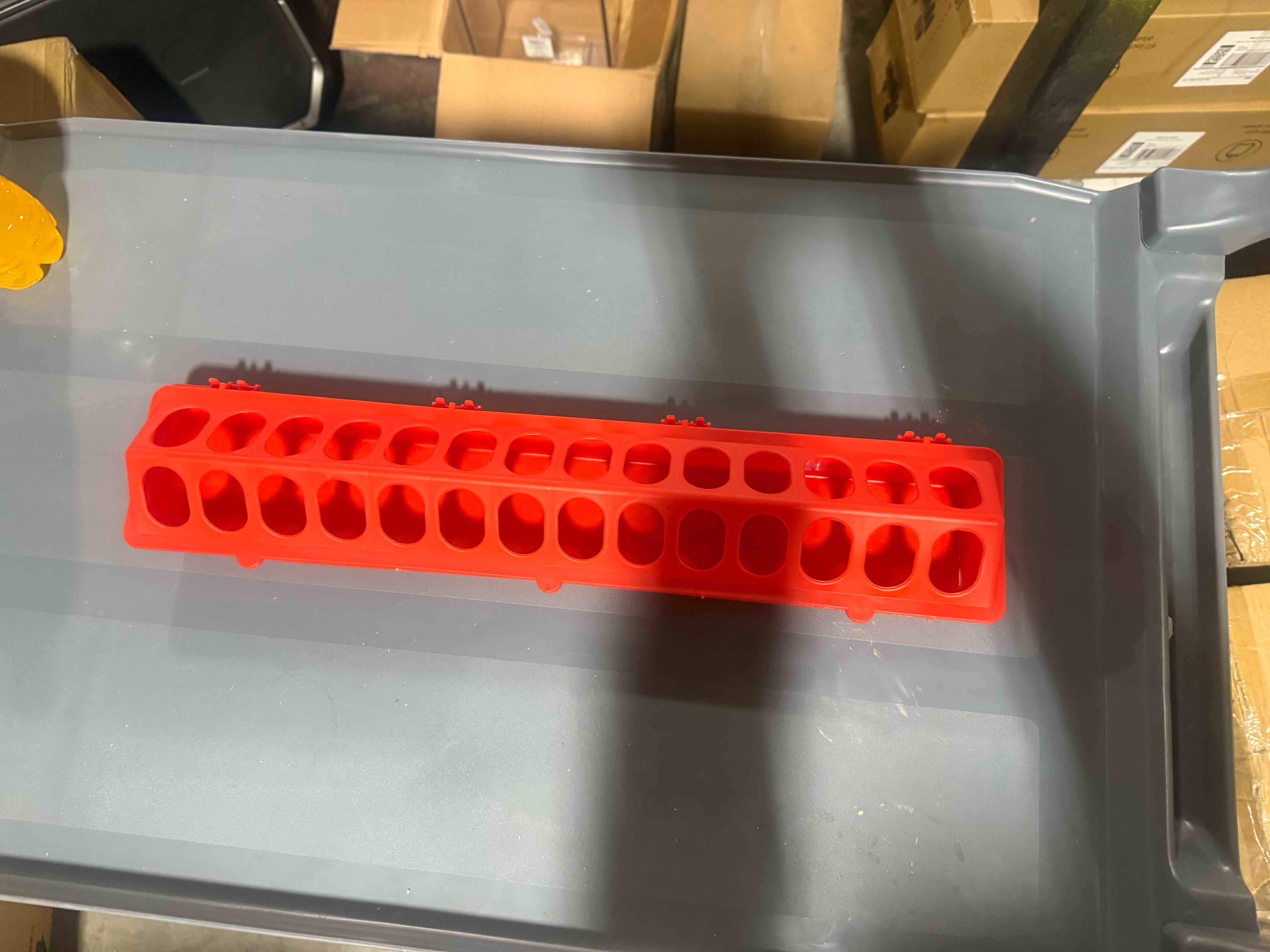 Condition photo showing New/Like New for durable red chicken feeder designed to minimize waste while allowing multiple birds to feed comfortably at once.