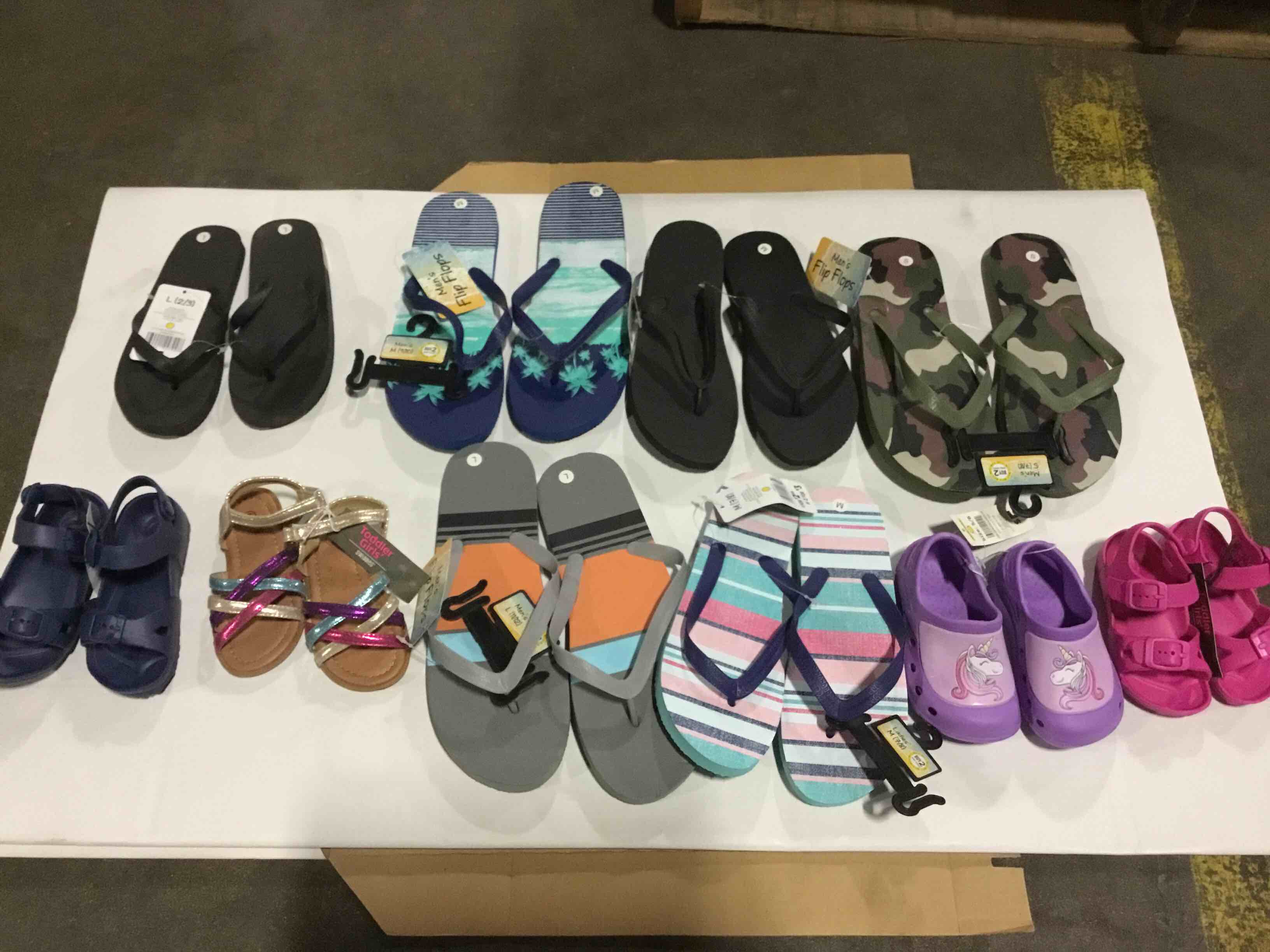 Assorted men’s, women’s, and kids sandals
