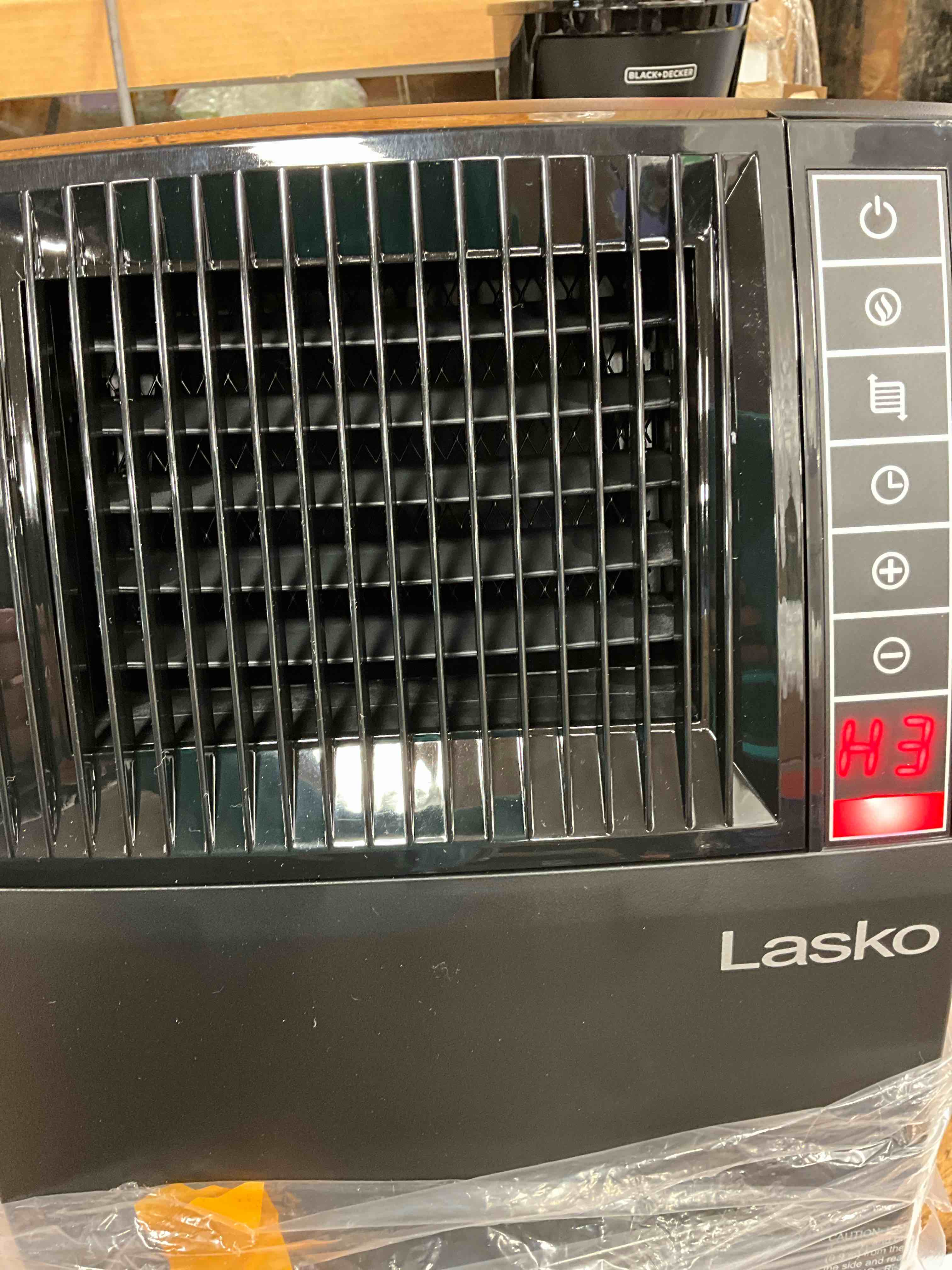 Condition photo showing New/Like New for 1500-Watt 20 in. Black Electric Console Ceramic Space Heater with Tip-Over Switch, Adjustable Louvers, Timer, Remote