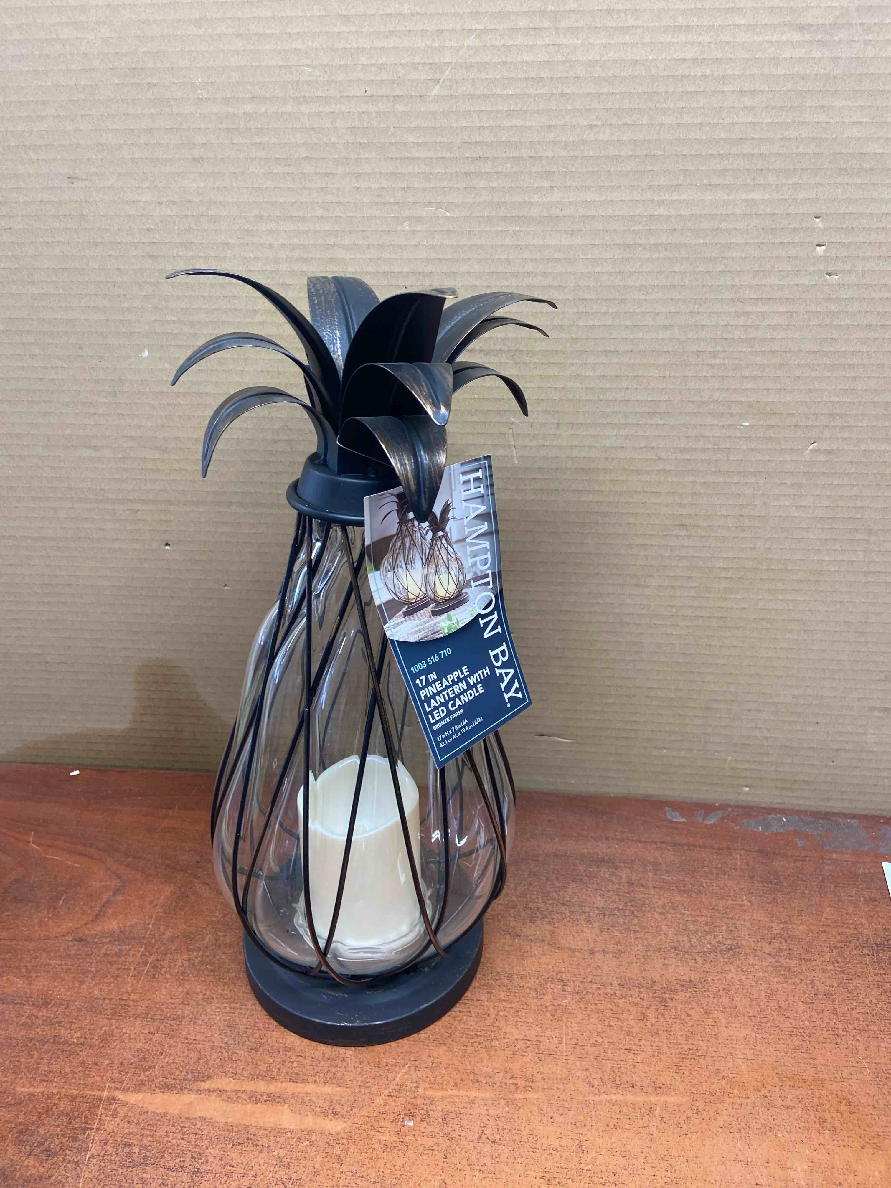 Condition photo showing New/Like New for 17 in. aged bronze outdoor patio led candle pineapple lantern