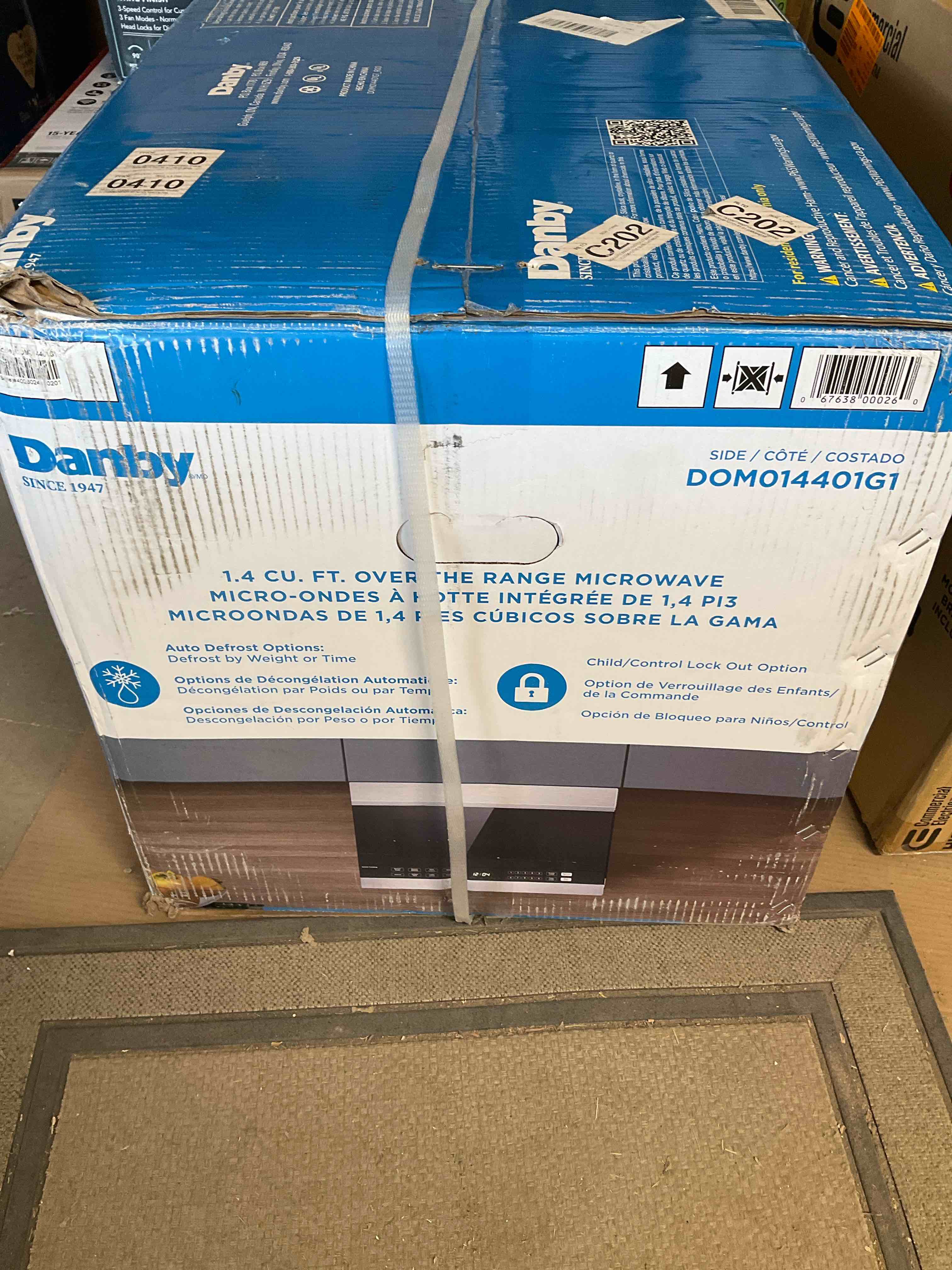 Condition photo showing New/Like New for danby 1.4 cu. ft. over the range microwave oven in stainless steel (dom014401g1)