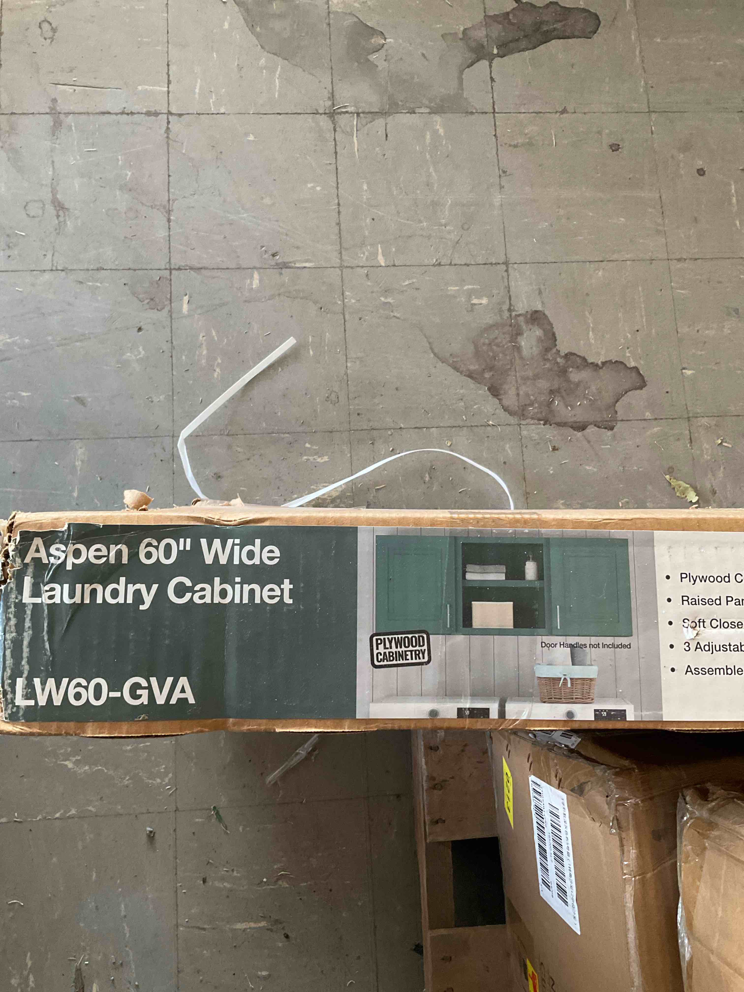 Condition photo showing New/Like New for greenwich aspen green 23 in. h x 60 in. w x 12 in. d plywood laundry room wall cabinet with 3 shelves