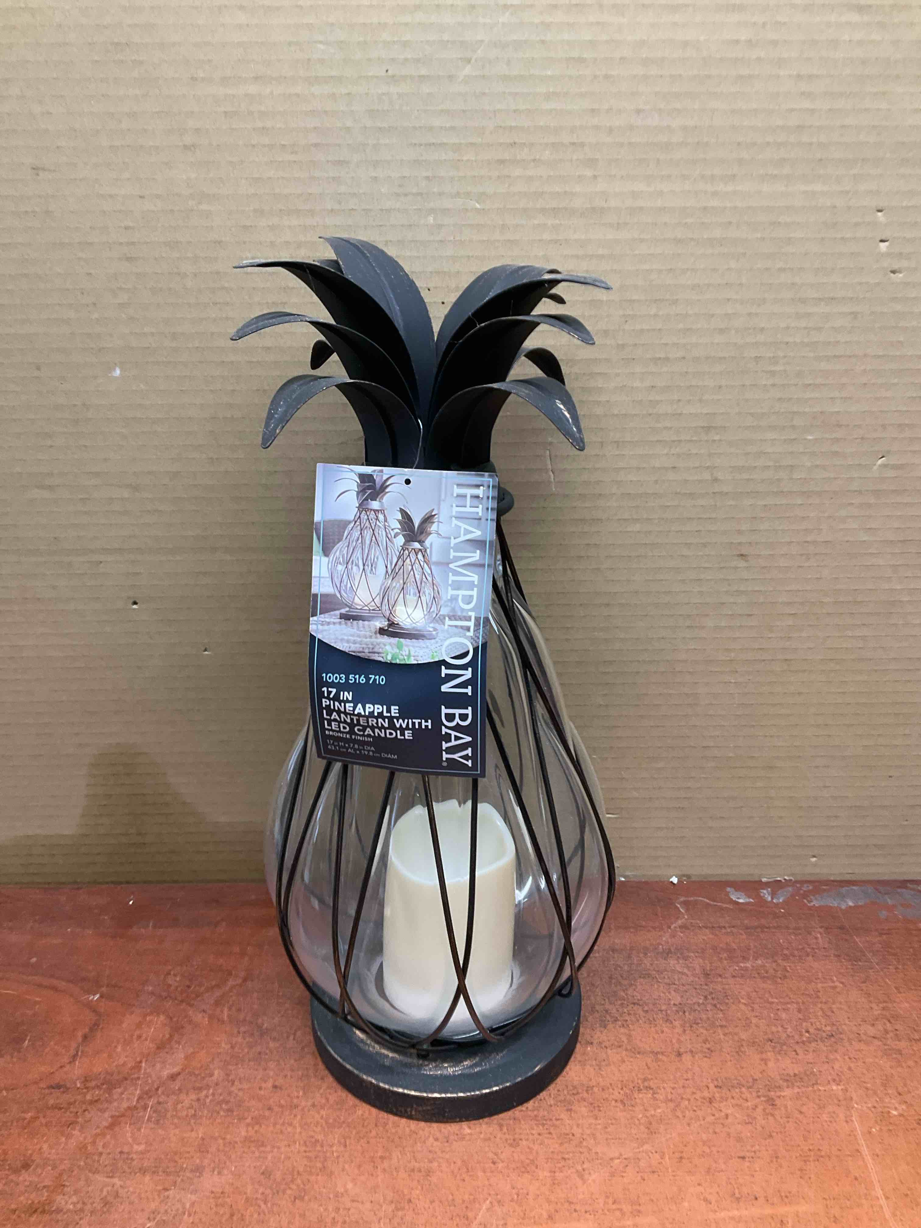 Condition photo showing New/Like New for 17 in. aged bronze outdoor patio led candle pineapple lantern