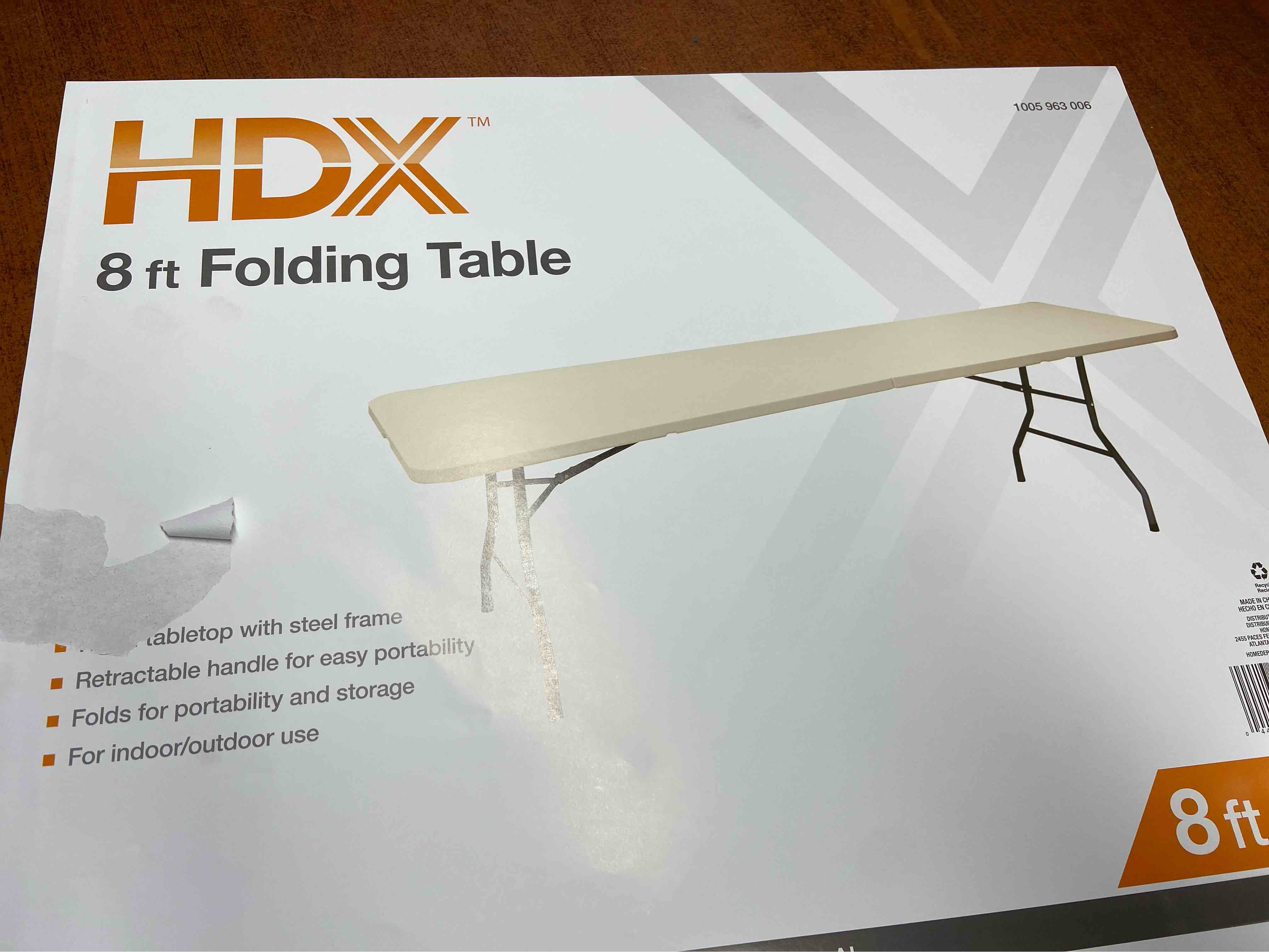 HDX 8 ft folding table ** table has a few marks and scratches please see pictures ***