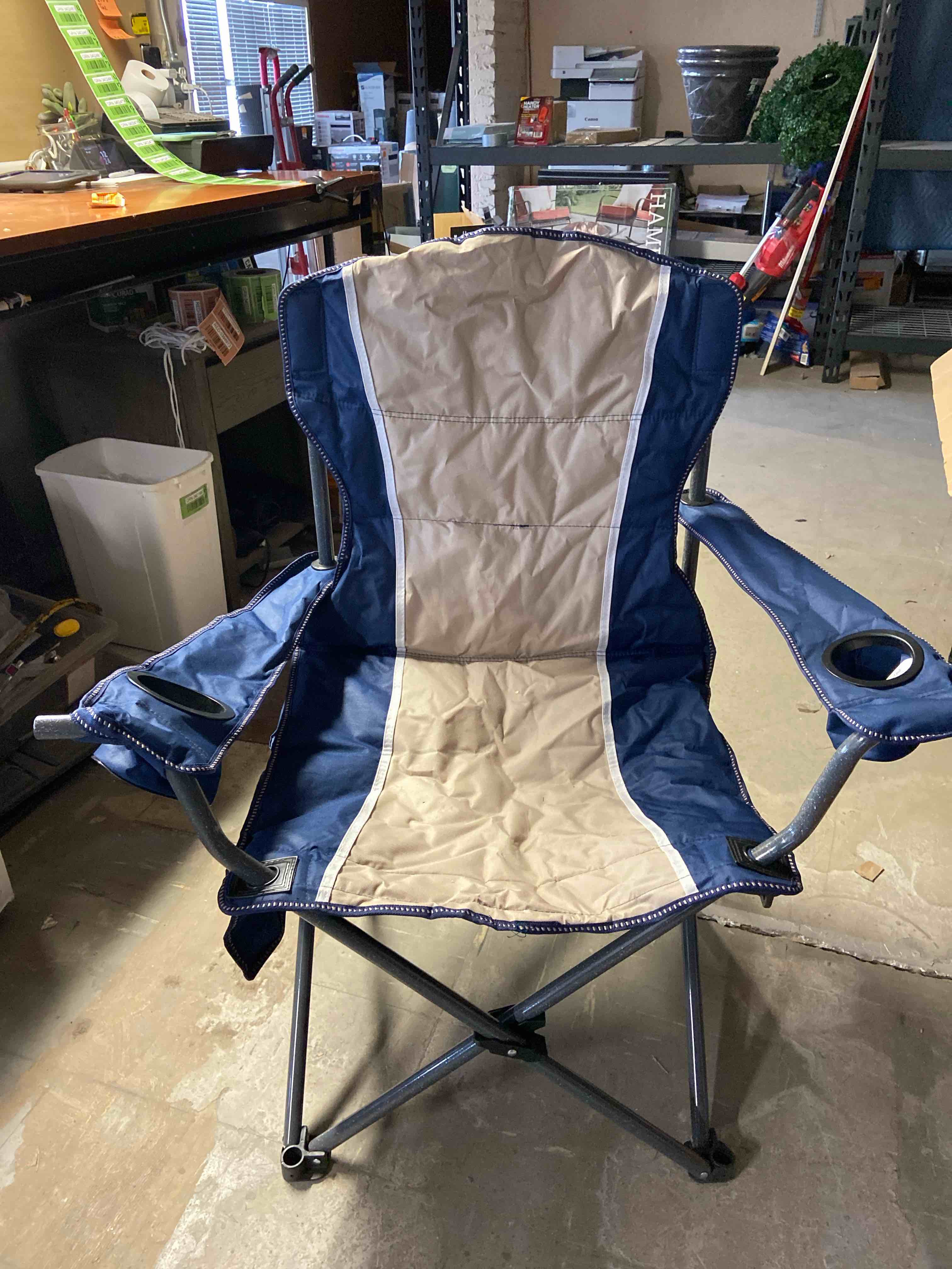 oversized folding chair with bag** ripped on edge by hand rest please see pictures **