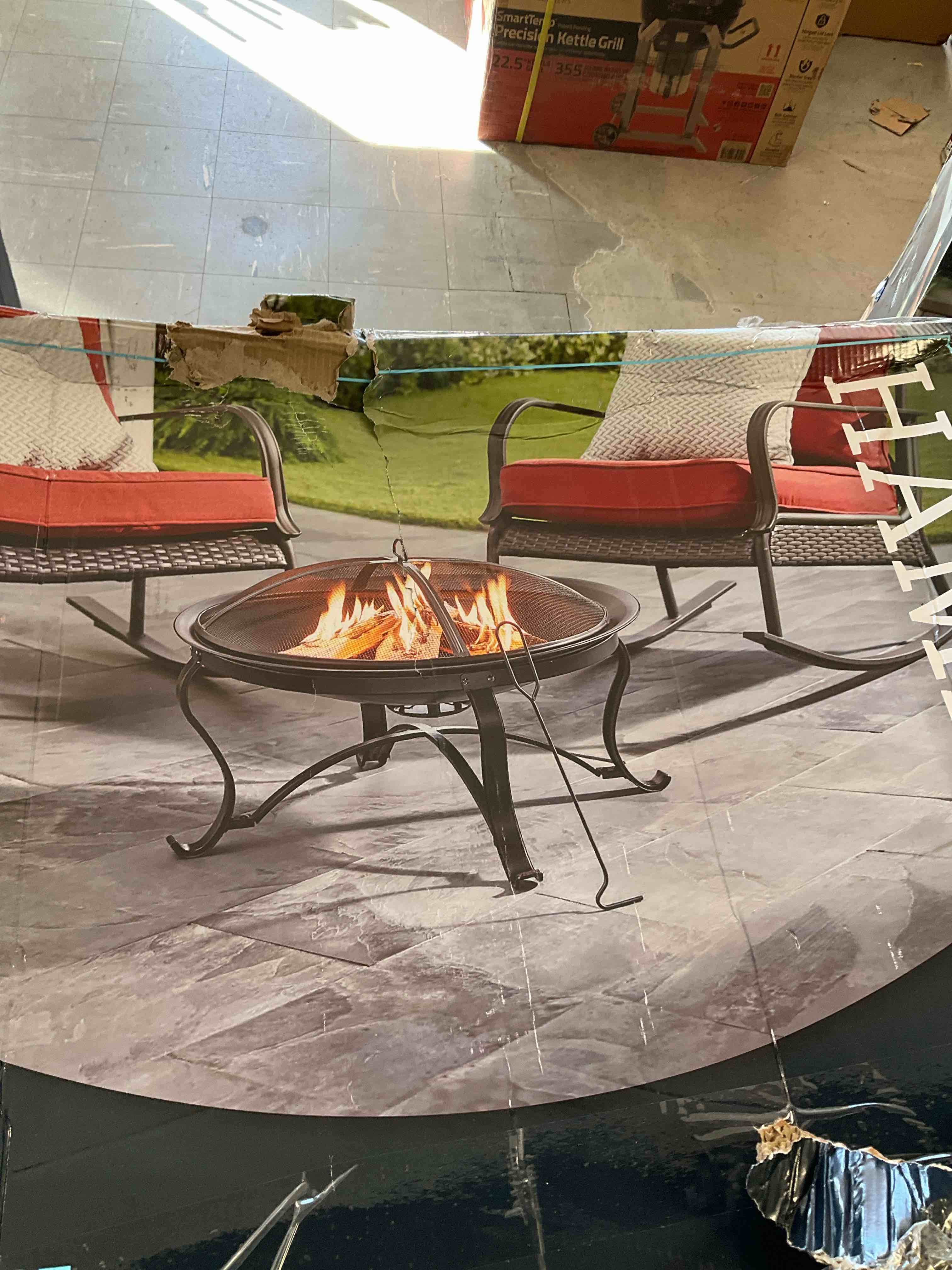 Sadler 30 in. x 19 in. Round Steel Wood Burning Fire Pit in Rubbed Bronze*** 2 spots will need to be reshaped please see pictures **