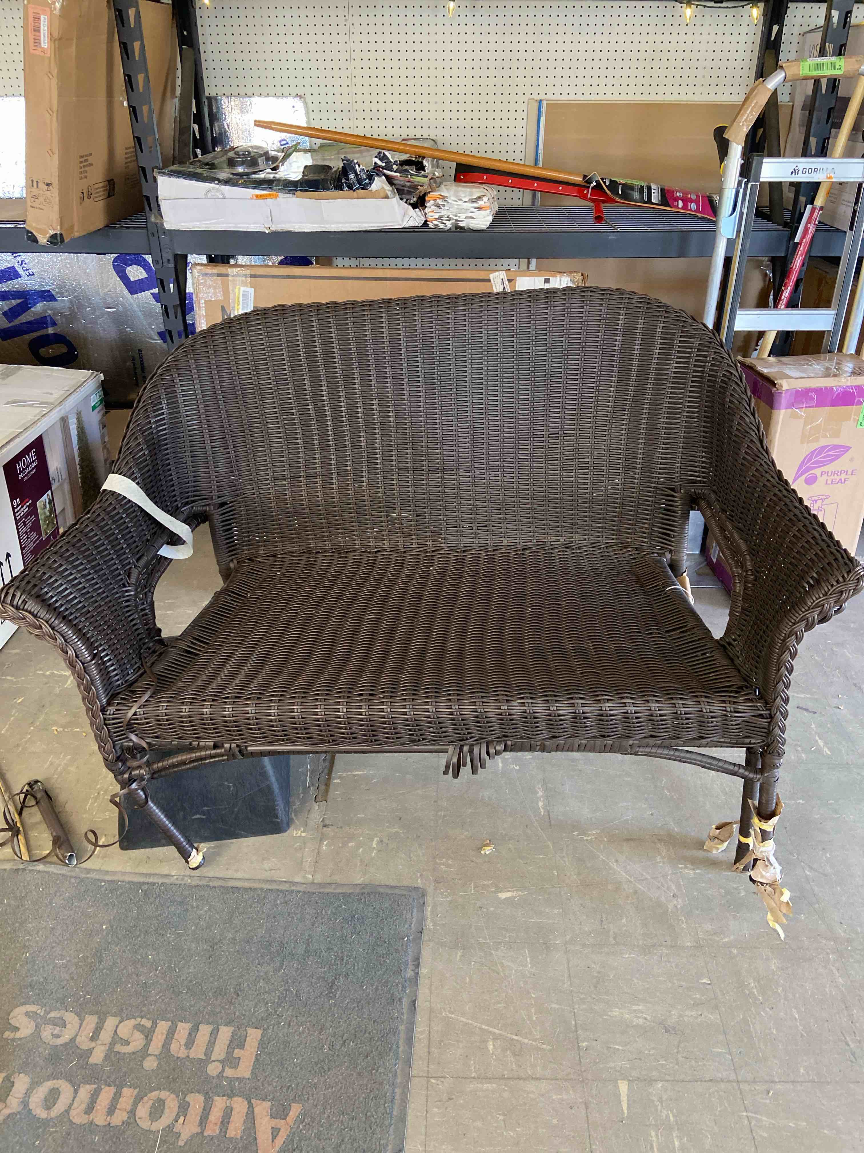 outdoor wicker loveseats dark brown ** both chairs have a broken front legs and some unraveling