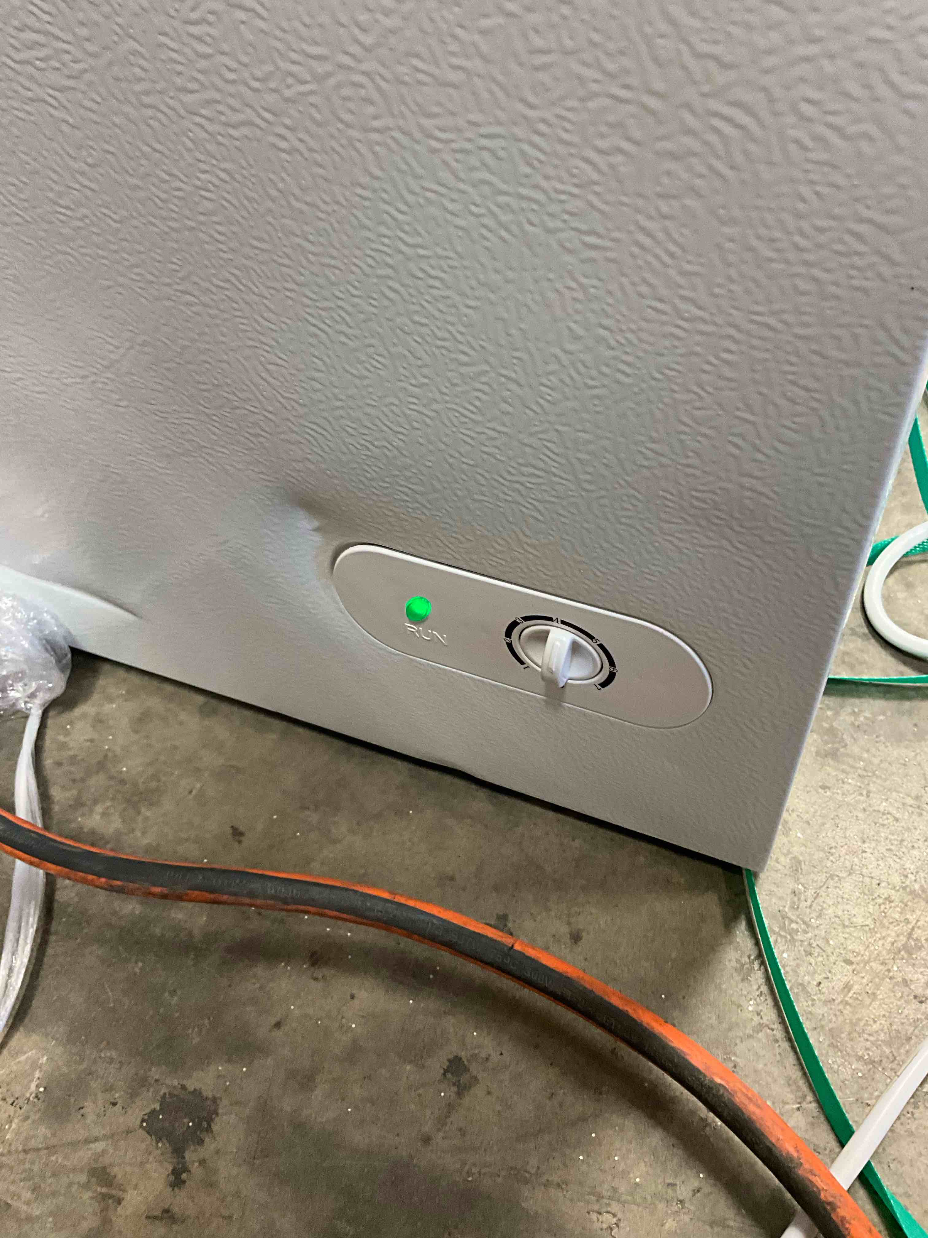 Condition photo showing Good Condition for Dented on lid (pictured below) Working Condition Verified. 5.0 cu. ft. Manual Defrost Chest Freezer with LED Light in White Garage Ready