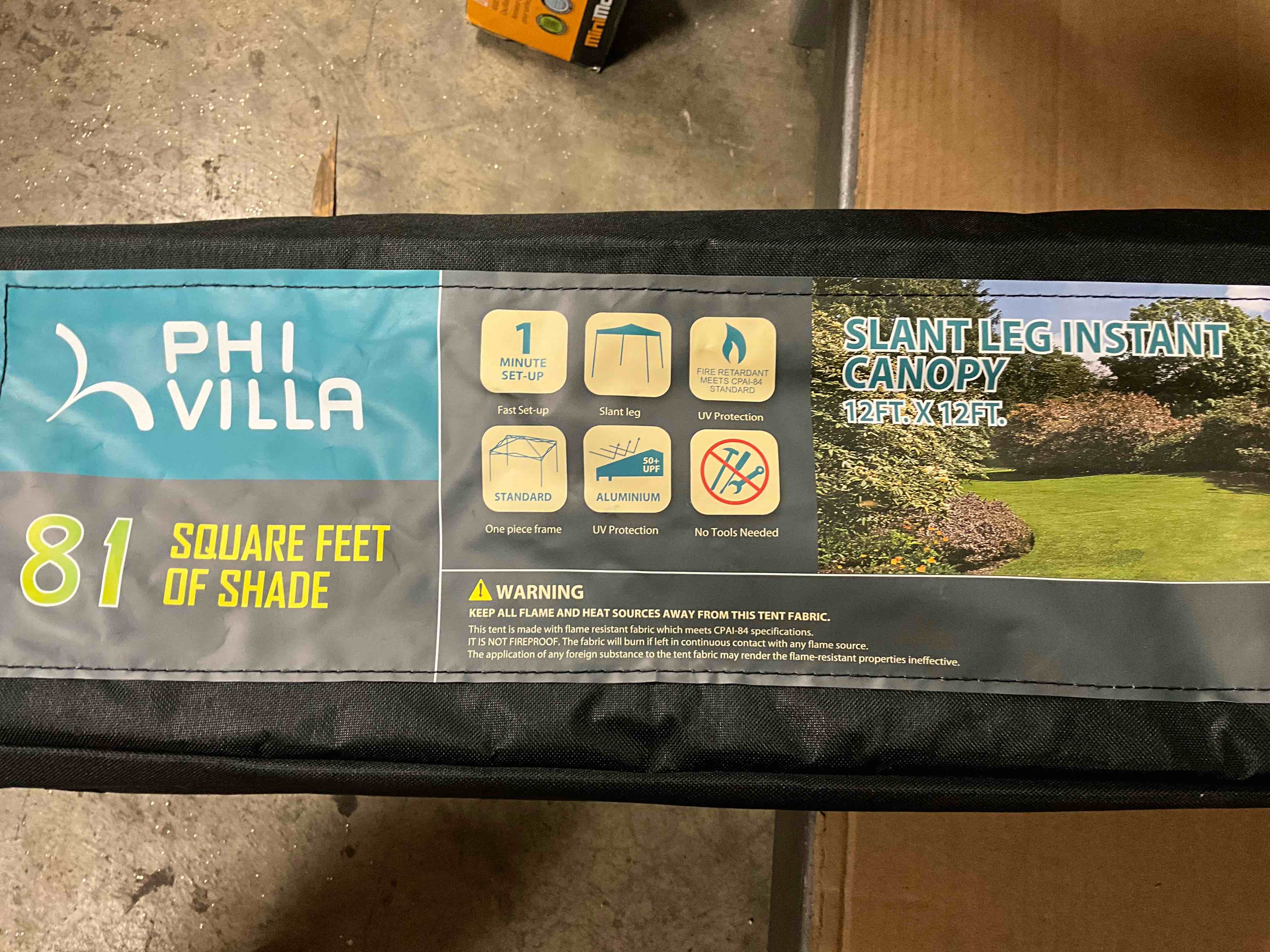Condition photo showing New/Like New for 12 ft. x 12 ft. blue slant leg pop-up canopy with 4 sandbags