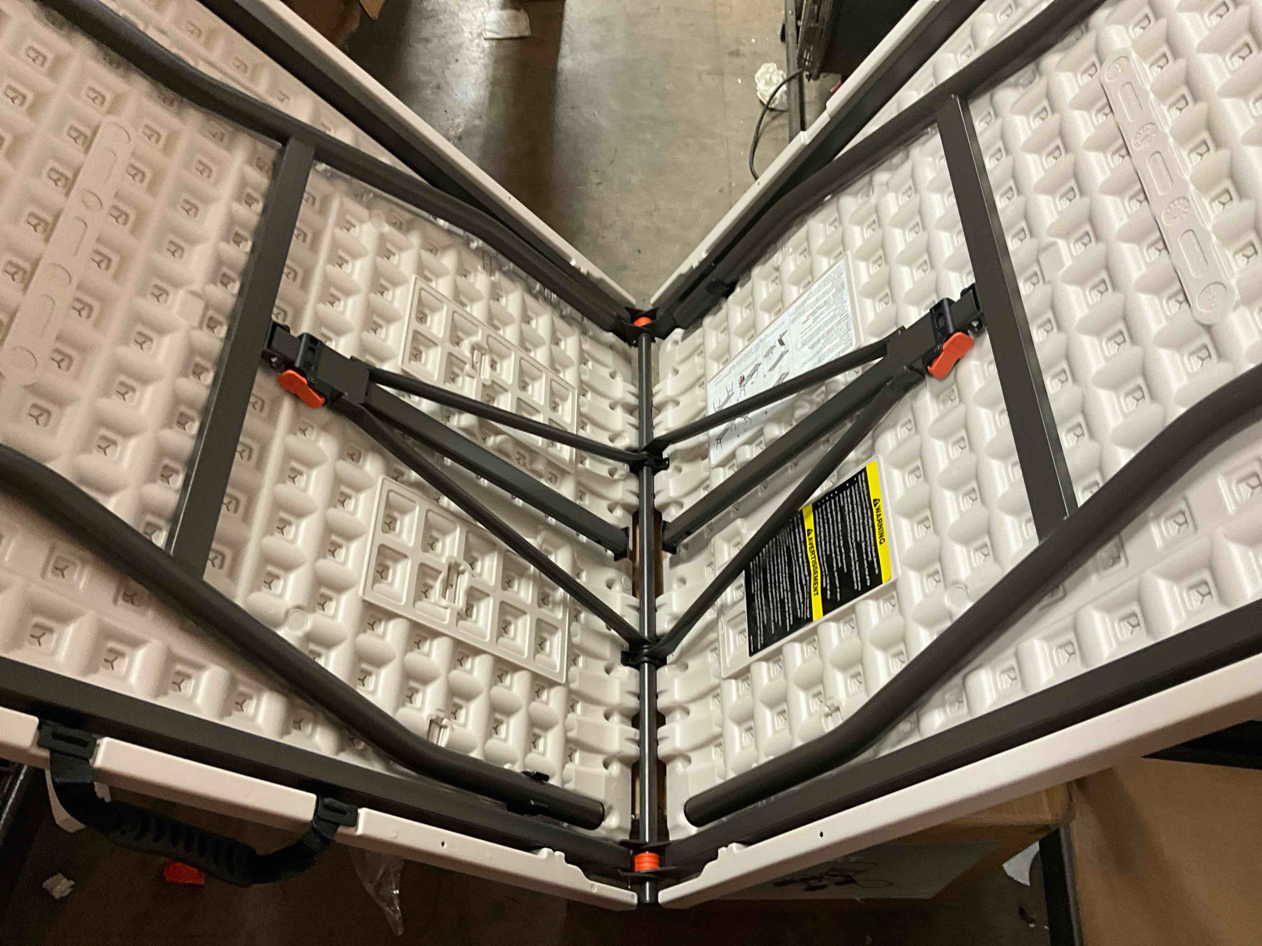 Condition photo showing Good Condition for 6 ft. almond resin top indoor/outdoor rectangular folding utility table, seats 6