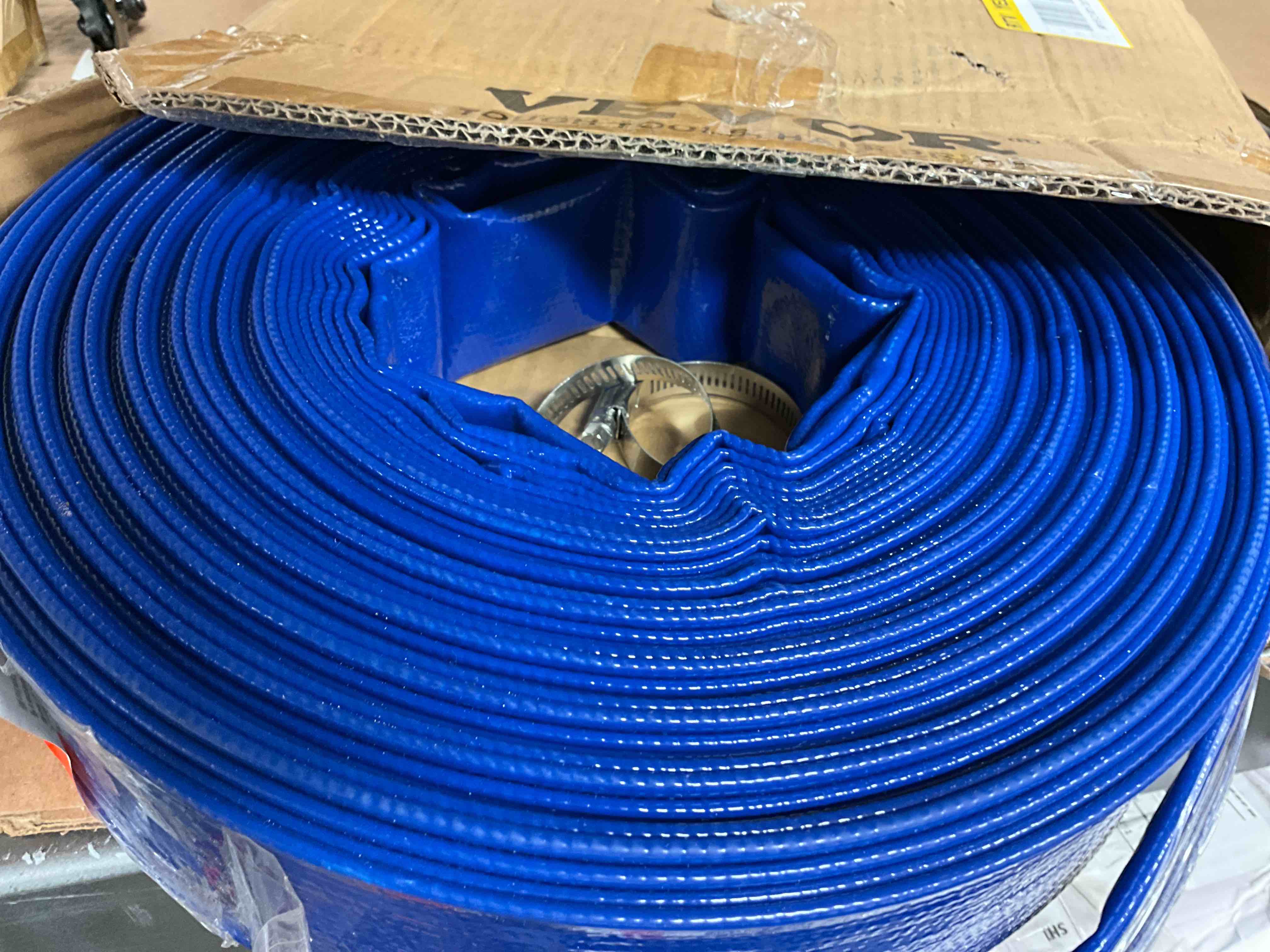 Condition photo showing New/Like New for discharge hose, 1-1/2 in. x 100 ft. pvc fabric lay flat hose, heavy duty backwash drain hose with clamps, weather-proof