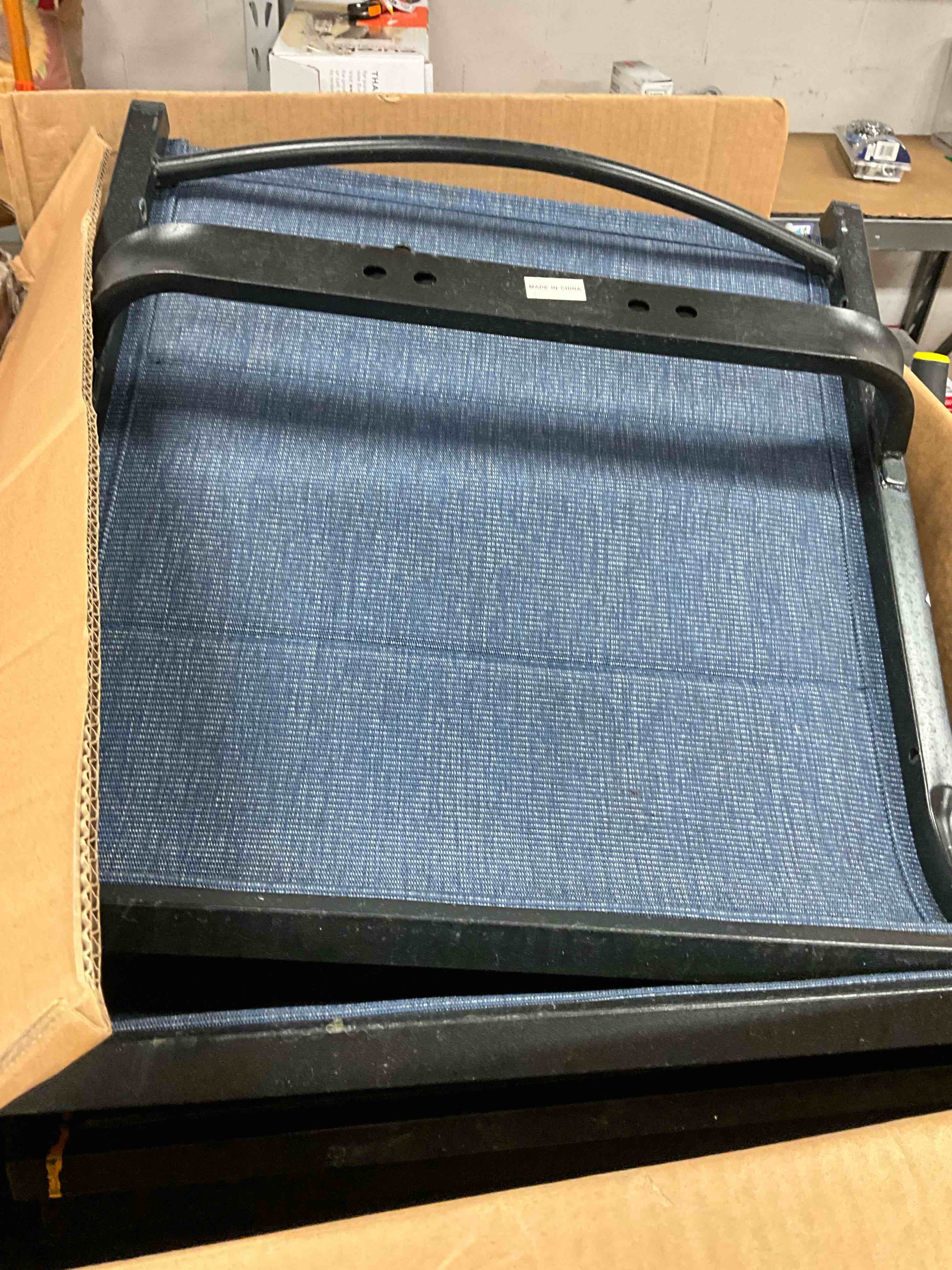 Previously Owned, Rusty. Blue Swivel Padded Blue Textilene Metal Outdoor Dining Chair with Curve Arms 